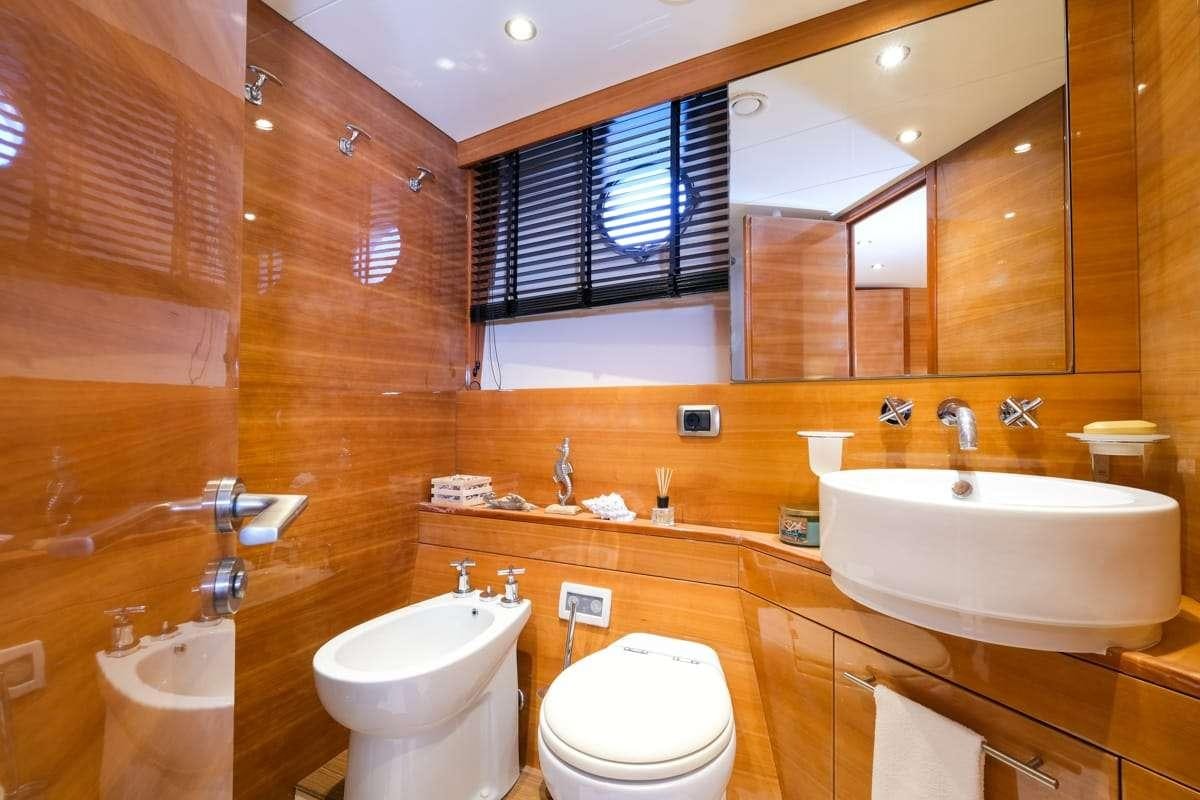 a bathroom with a sink toilet and a bathtub aboard SUMMER THERAPY Yacht for Charter