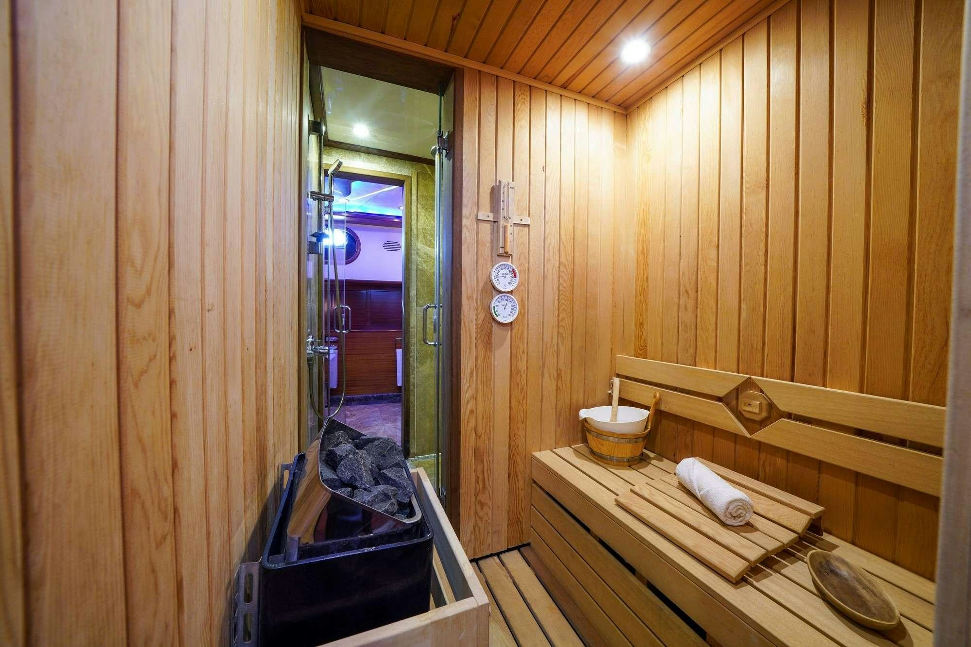 a bathroom with a tub sink and a sink aboard LA BELLA VITA Yacht for Charter