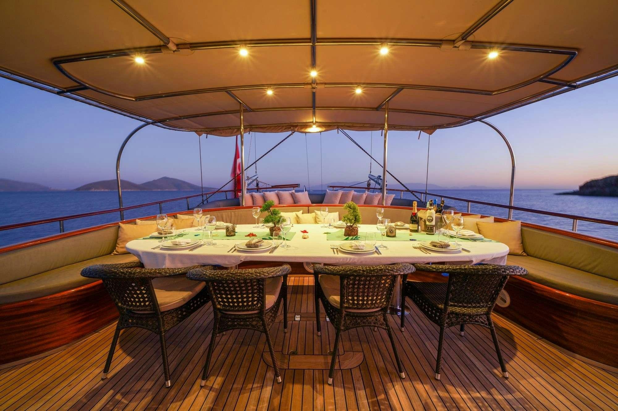 a table set for a meal aboard LA BELLA VITA Yacht for Charter