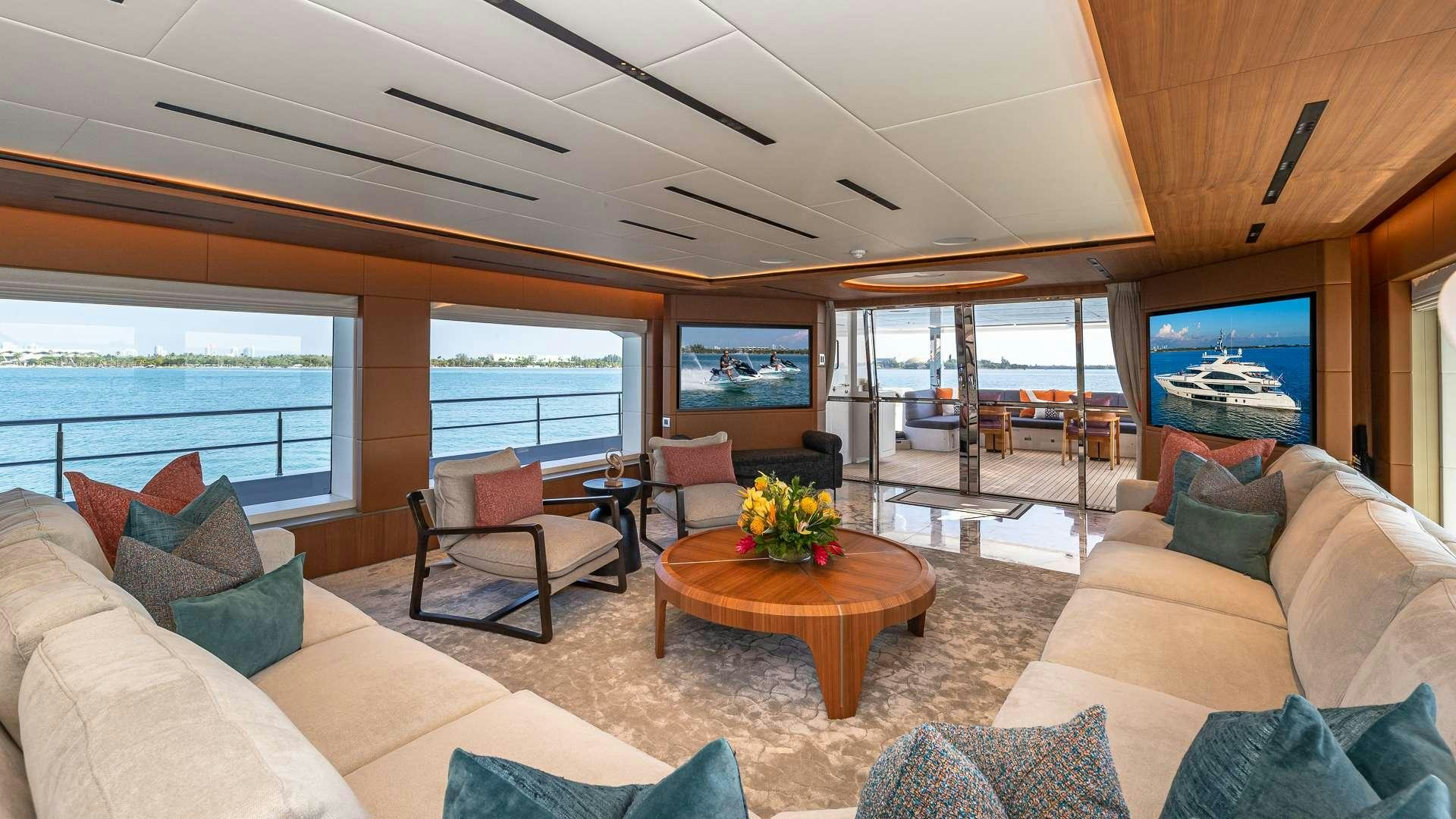 a living room with a large window aboard RISING DAWN Yacht for Charter