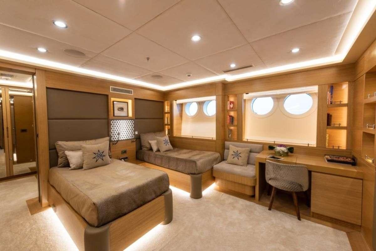 a living room with a couch and a table aboard ARESTEAS Yacht for Charter