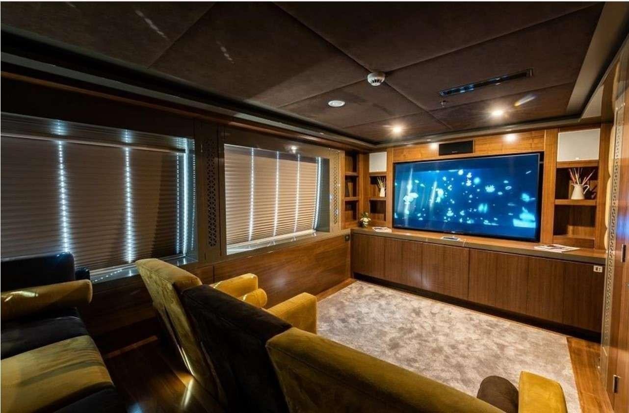 a large room with a tv aboard ARESTEAS Yacht for Charter