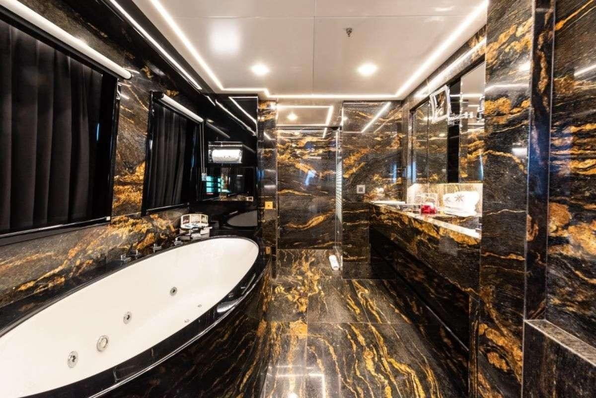 a bathroom with a large tub aboard ARESTEAS Yacht for Charter