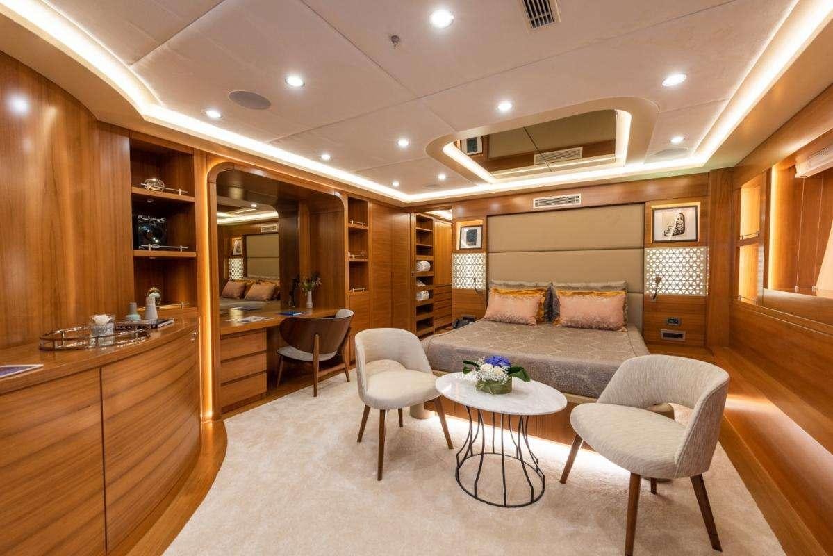a living room with a couch and a table aboard ARESTEAS Yacht for Charter