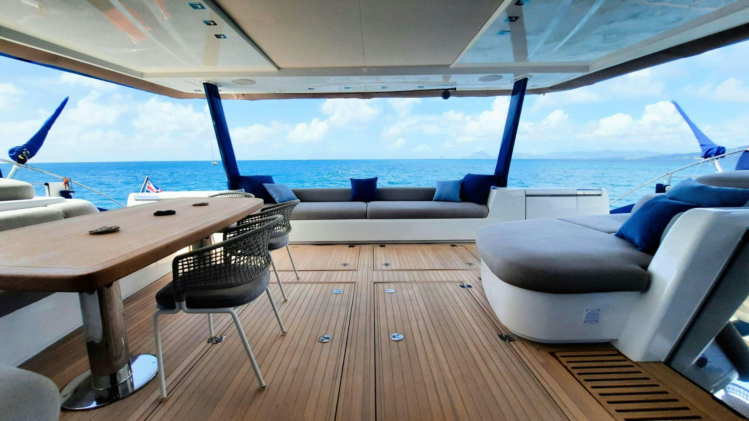 a room with a table and chairs aboard MANE ET NOCTE Yacht for Charter