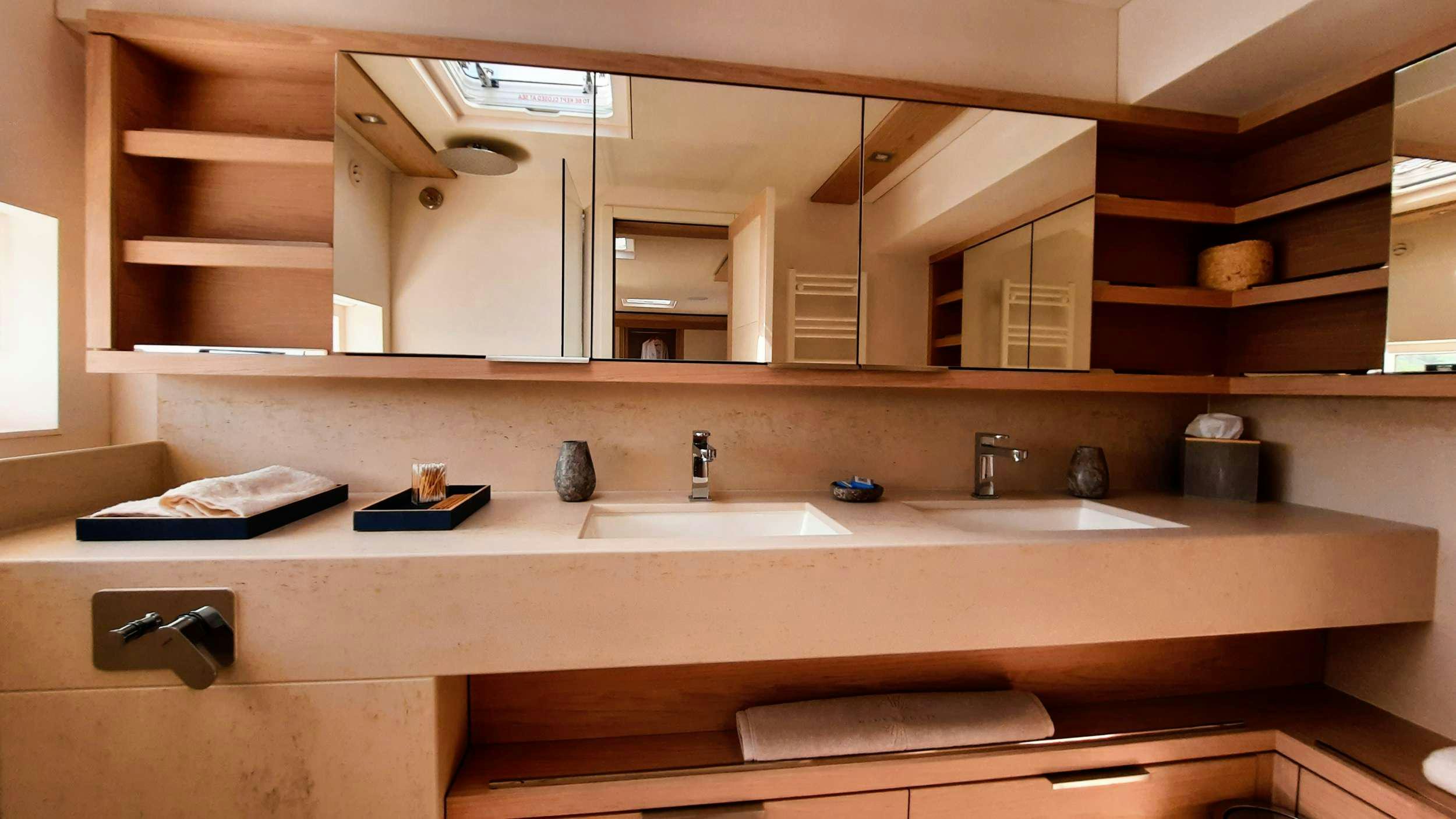 a bathroom with a large mirror aboard MANE ET NOCTE Yacht for Charter