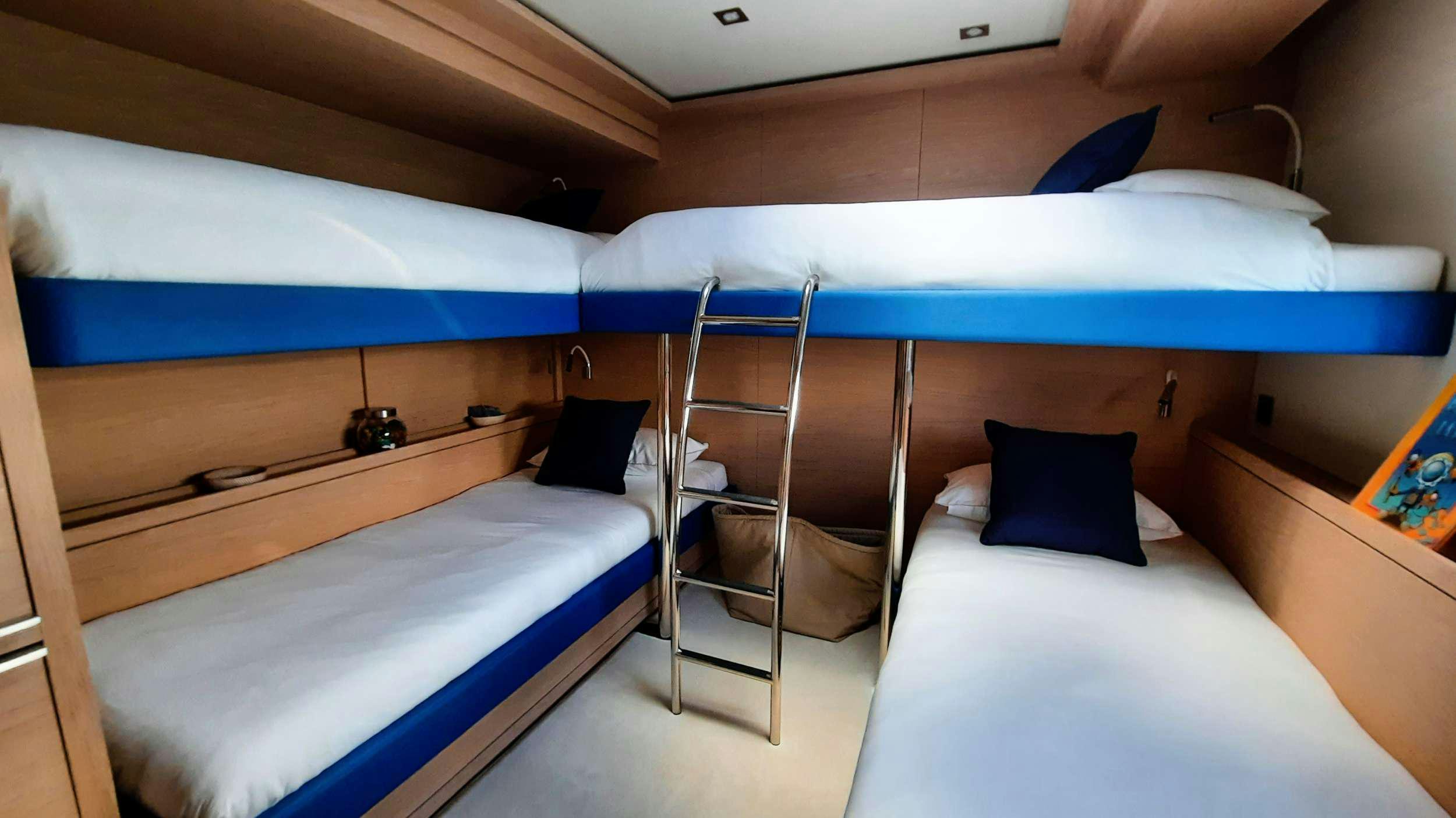 a room with bunk beds aboard MANE ET NOCTE Yacht for Charter