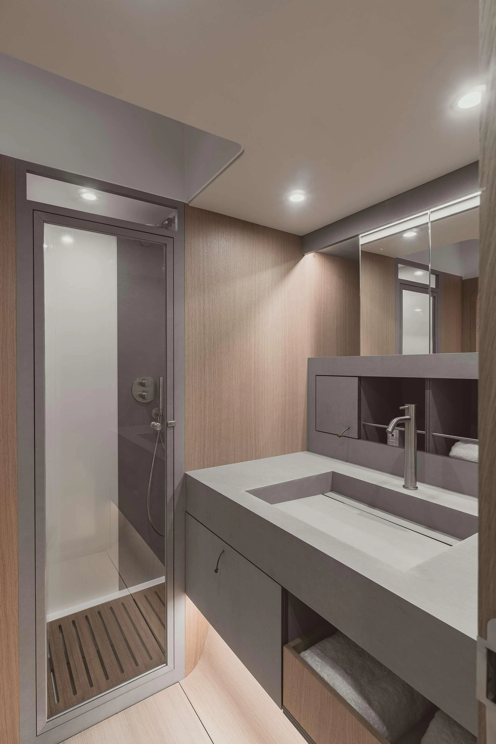 a bathroom with a glass shower aboard NADAMAS Yacht for Charter