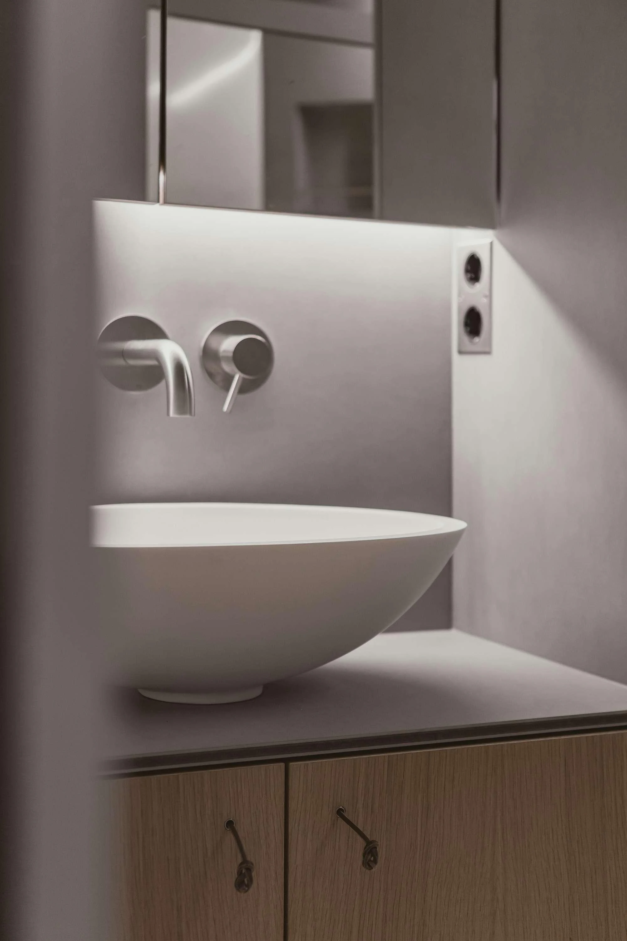 a white sink in a kitchen aboard NADAMAS Yacht for Charter