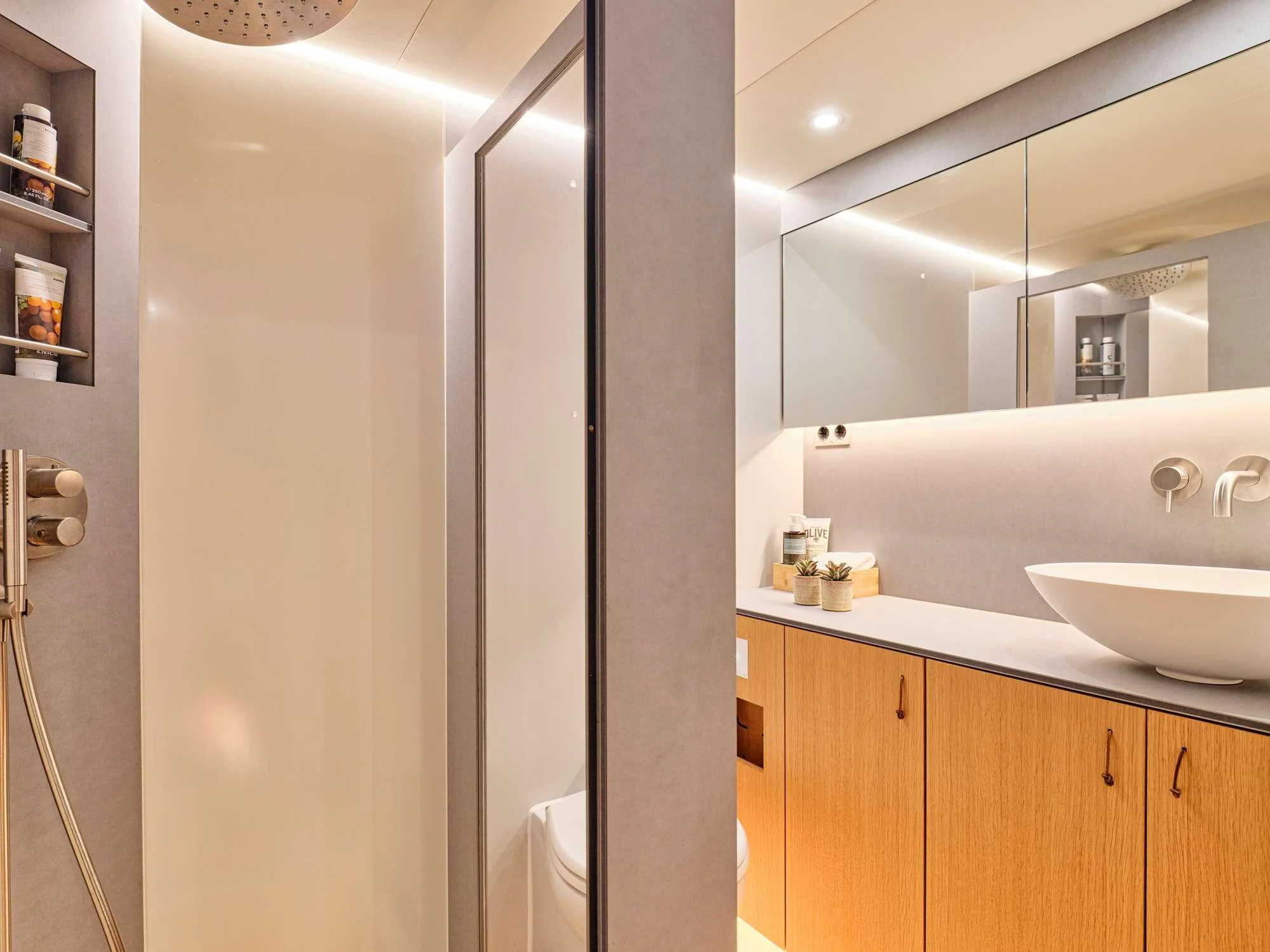 a bathroom with a sink and a shower aboard NADAMAS Yacht for Charter