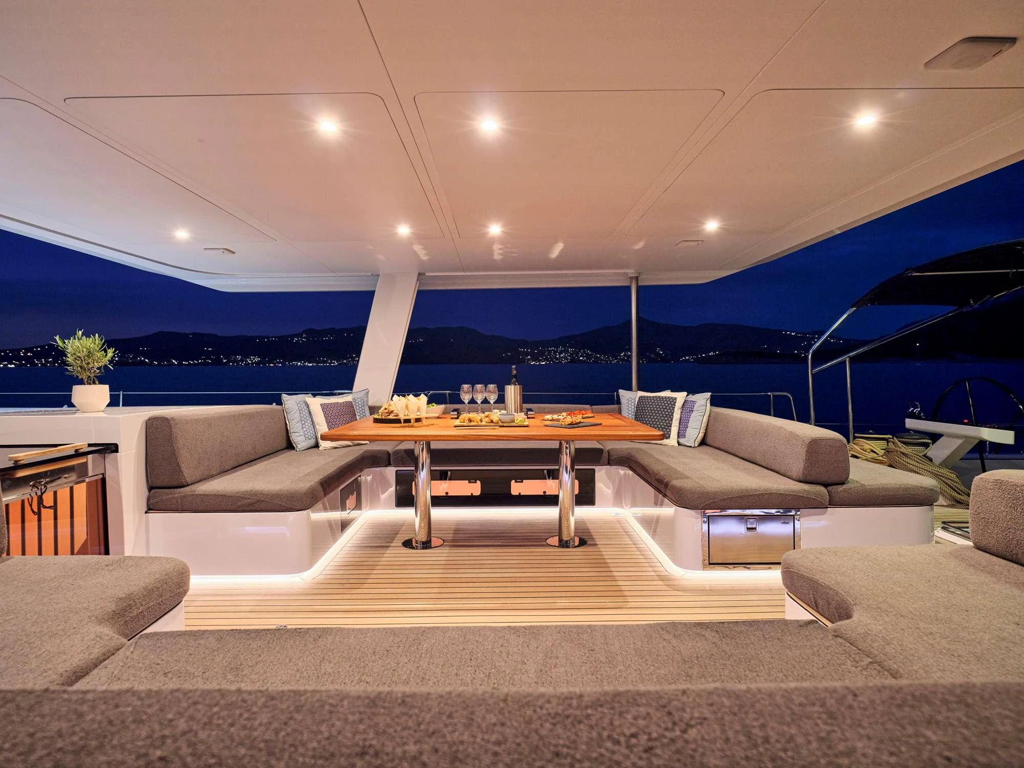 a living room with a large patio aboard NADAMAS Yacht for Charter