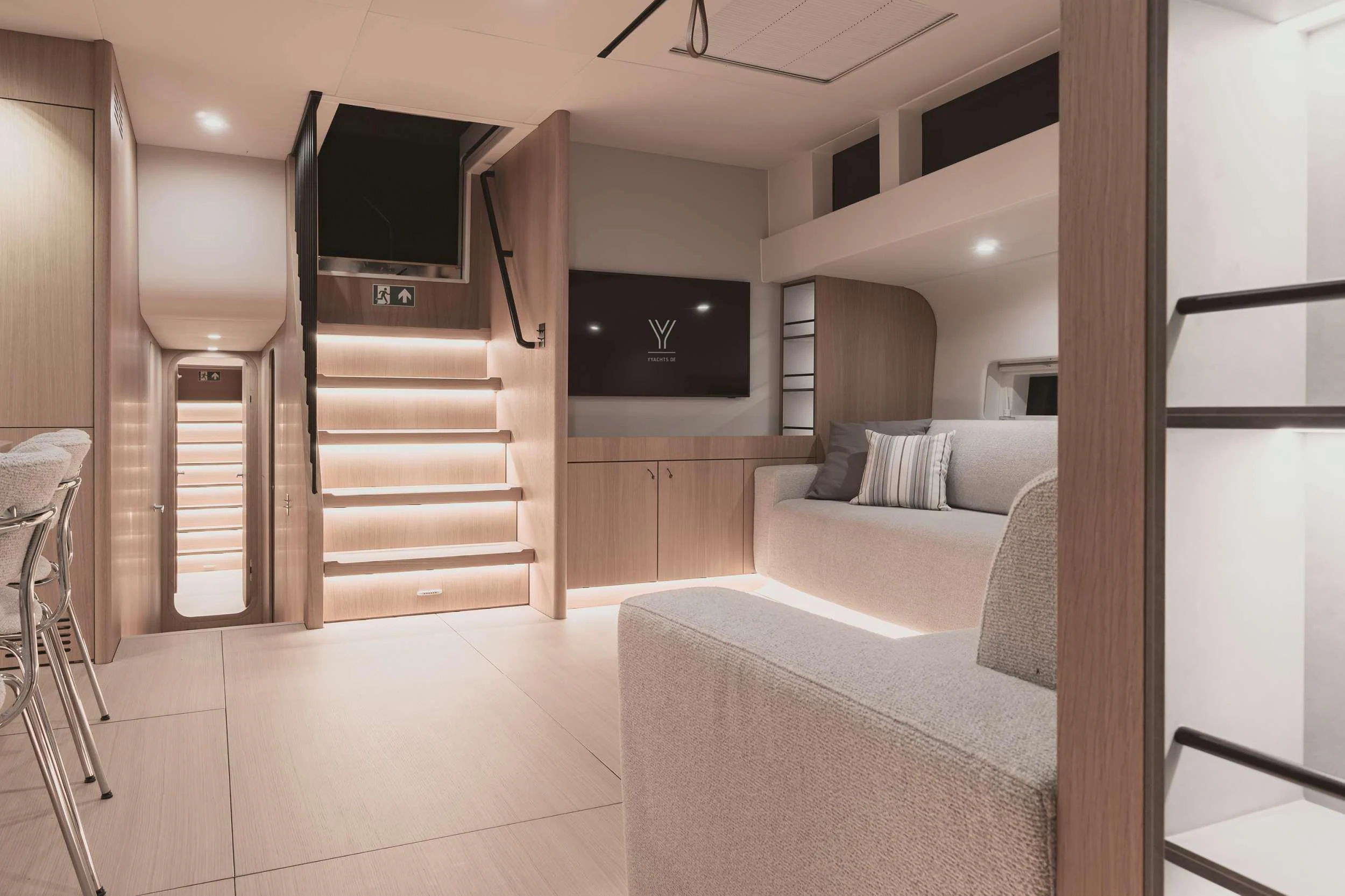 a living room with a large tv aboard NADAMAS Yacht for Charter