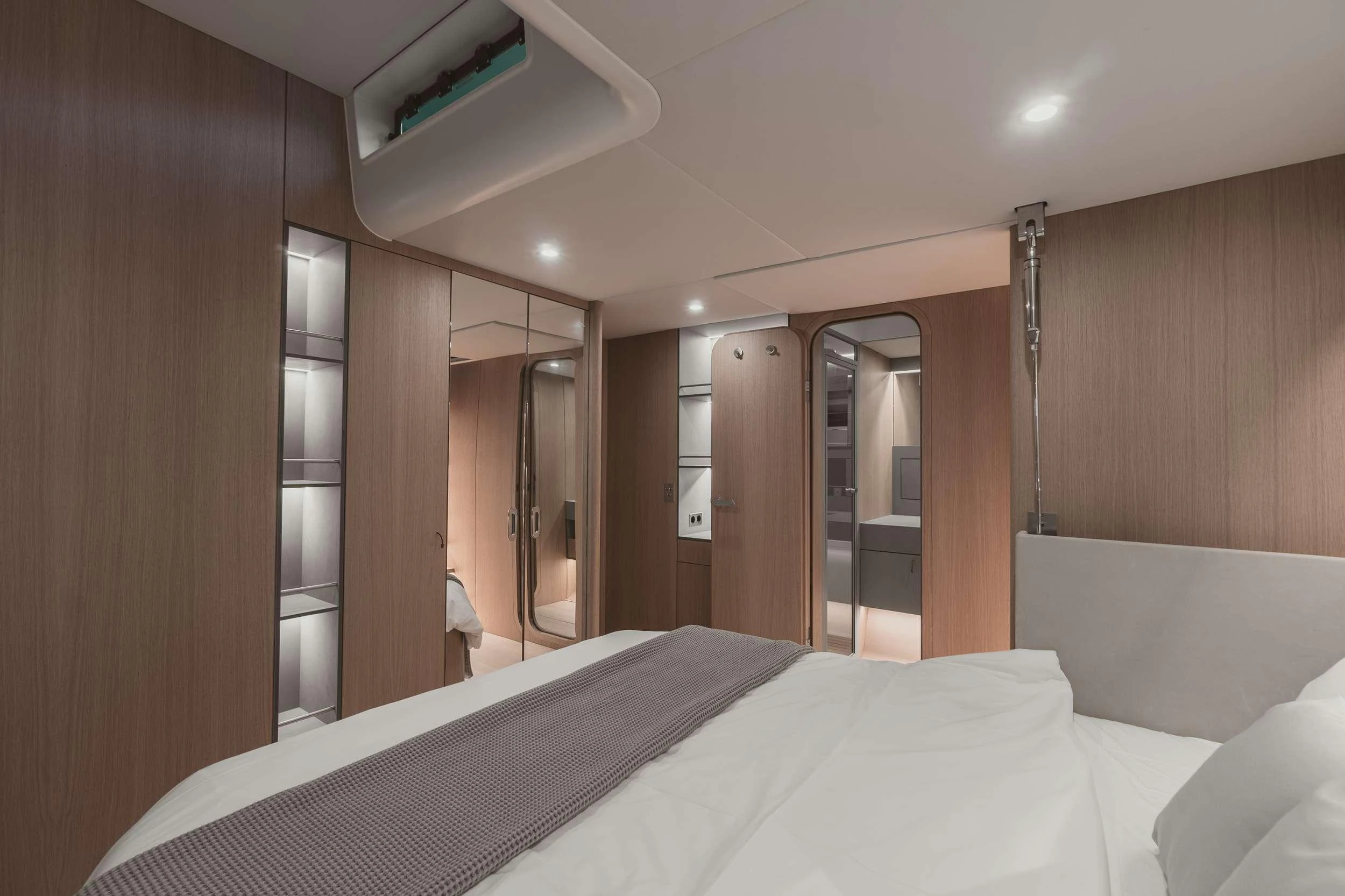 a hotel room with a bed aboard NADAMAS Yacht for Charter