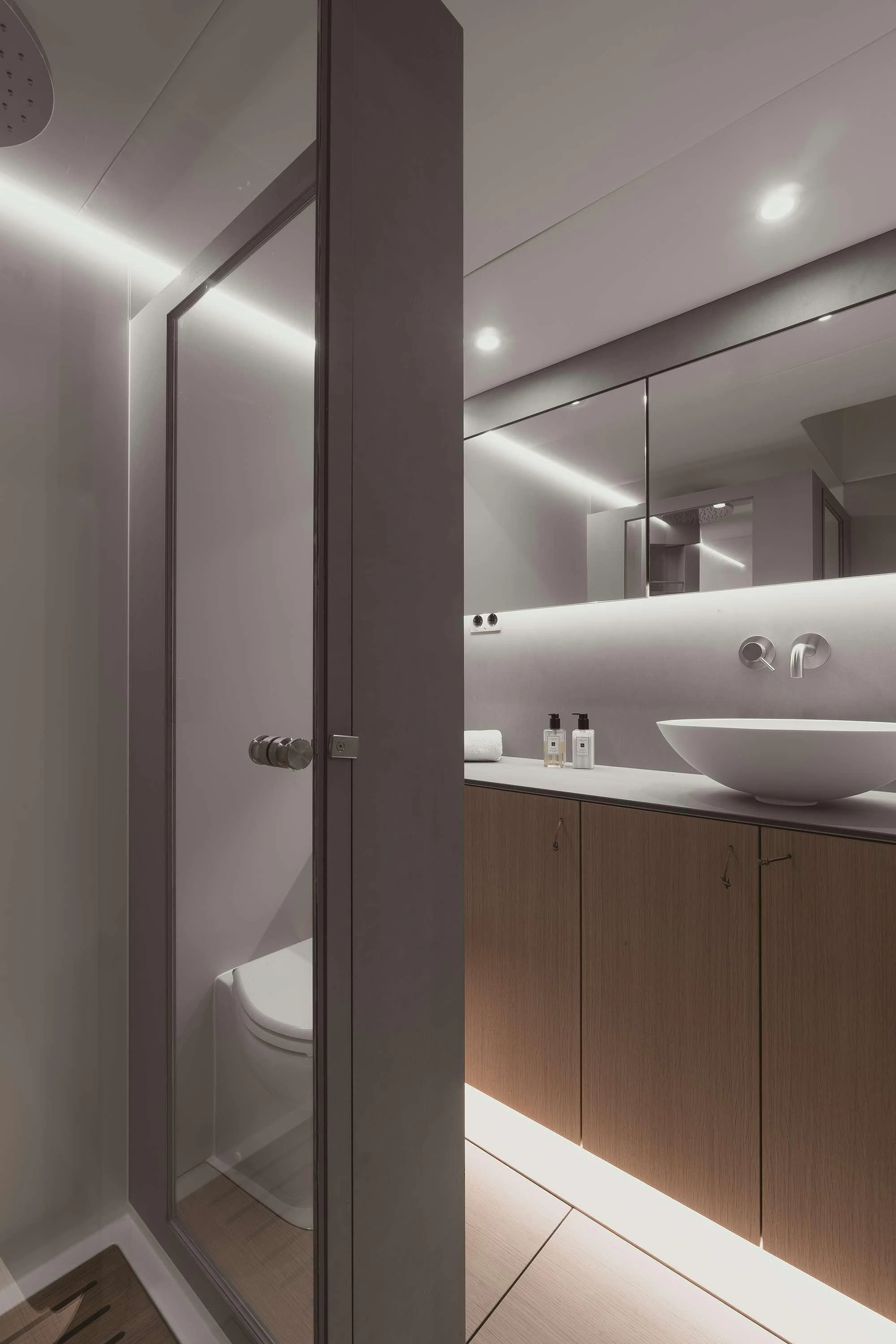 a bathroom with a sink and a toilet aboard NADAMAS Yacht for Charter