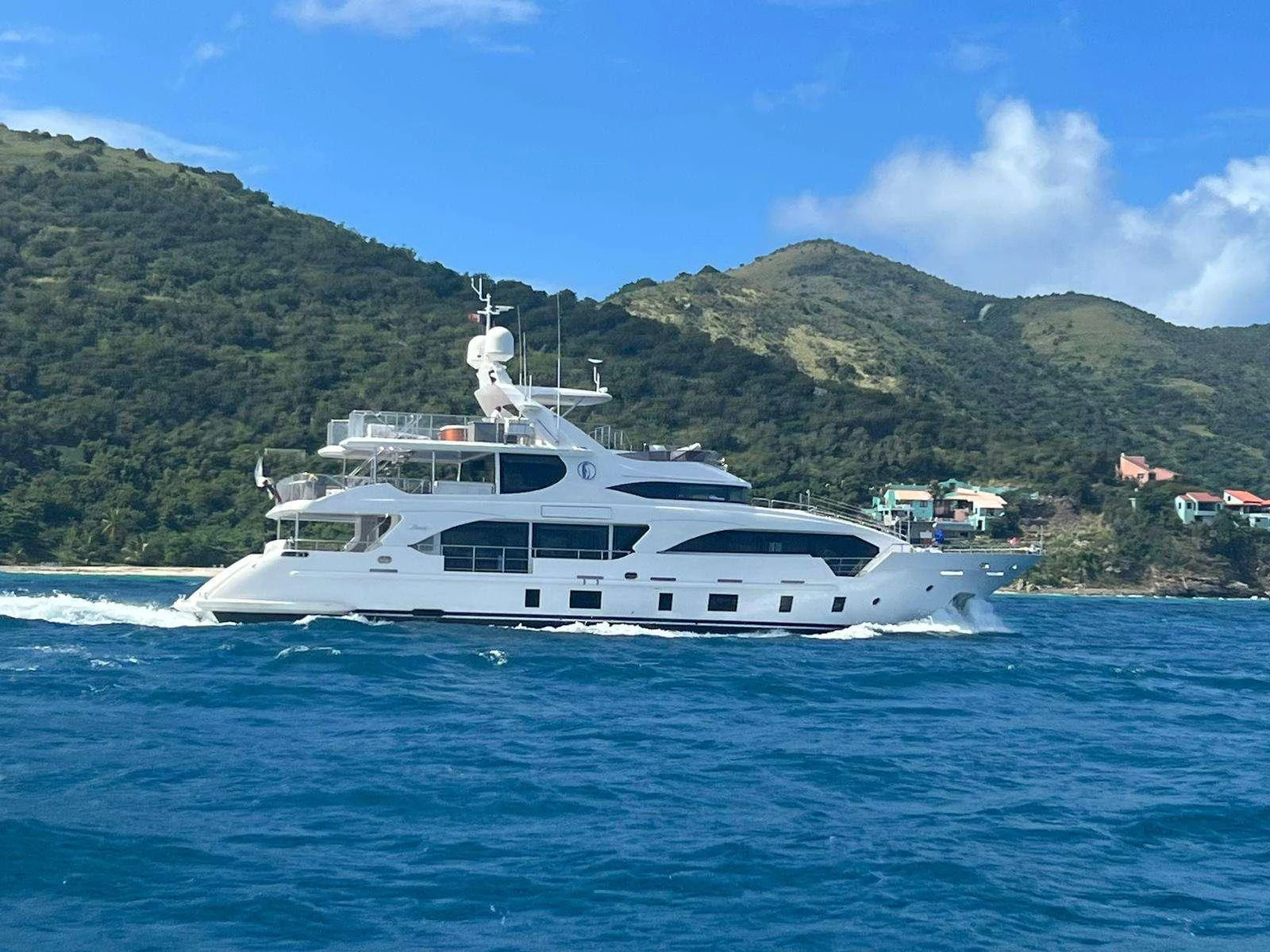 a white yacht on the water aboard LULU Yacht for Charter