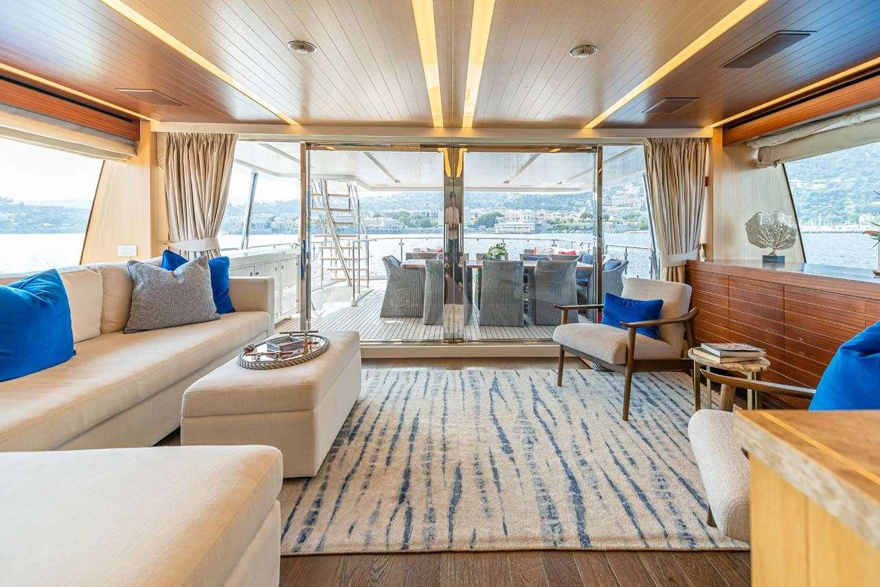 a living room with a large window aboard LULU Yacht for Charter