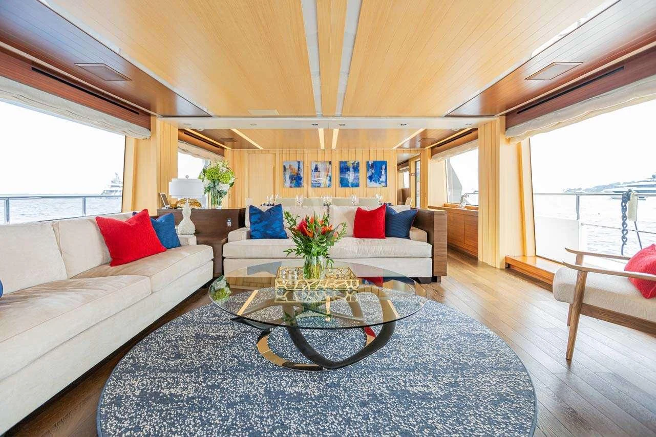 a living room with a couch and a coffee table aboard LULU Yacht for Charter