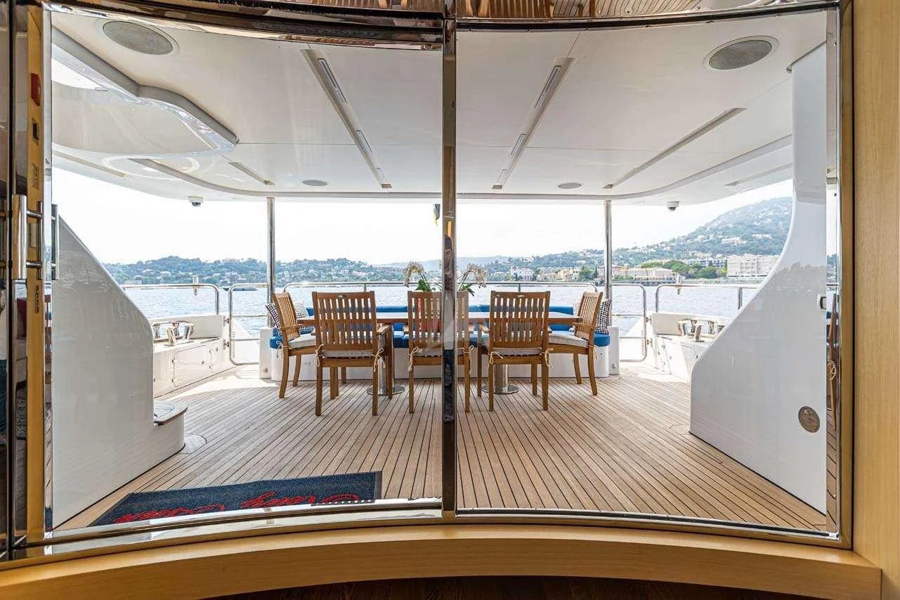 a room with a table and chairs aboard LULU Yacht for Charter