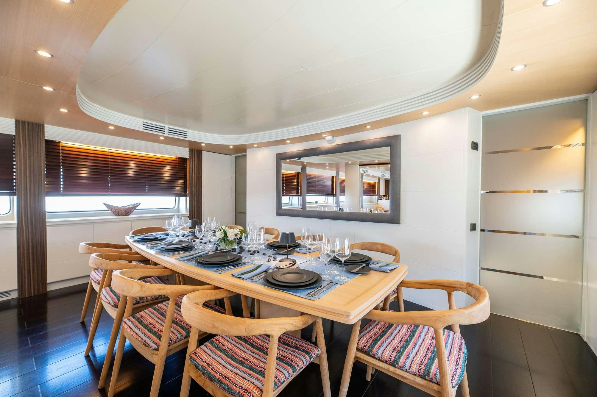 a dining table in a room aboard PEREAKI II Yacht for Charter