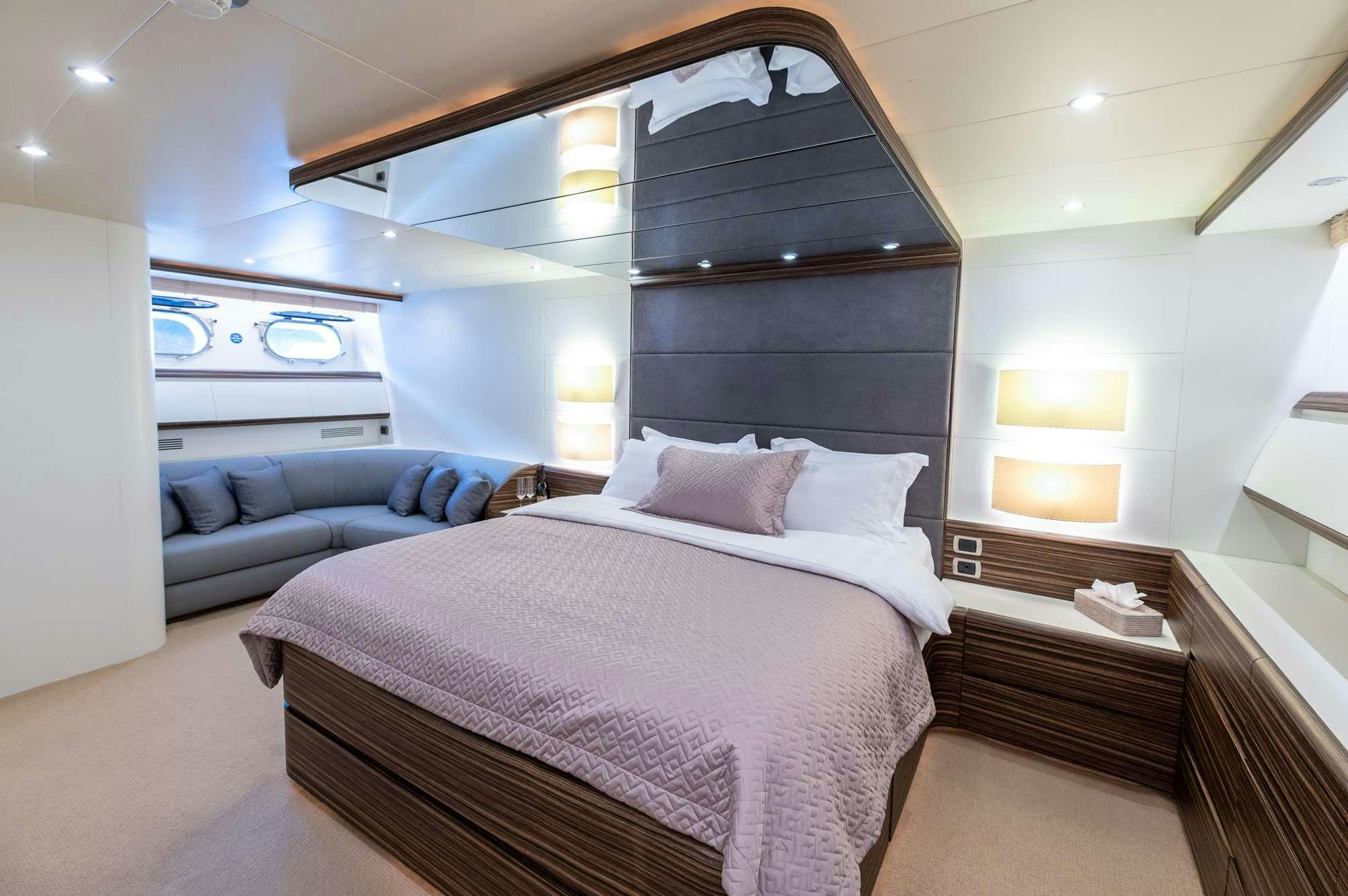 a bed in a room aboard PEREAKI II Yacht for Charter