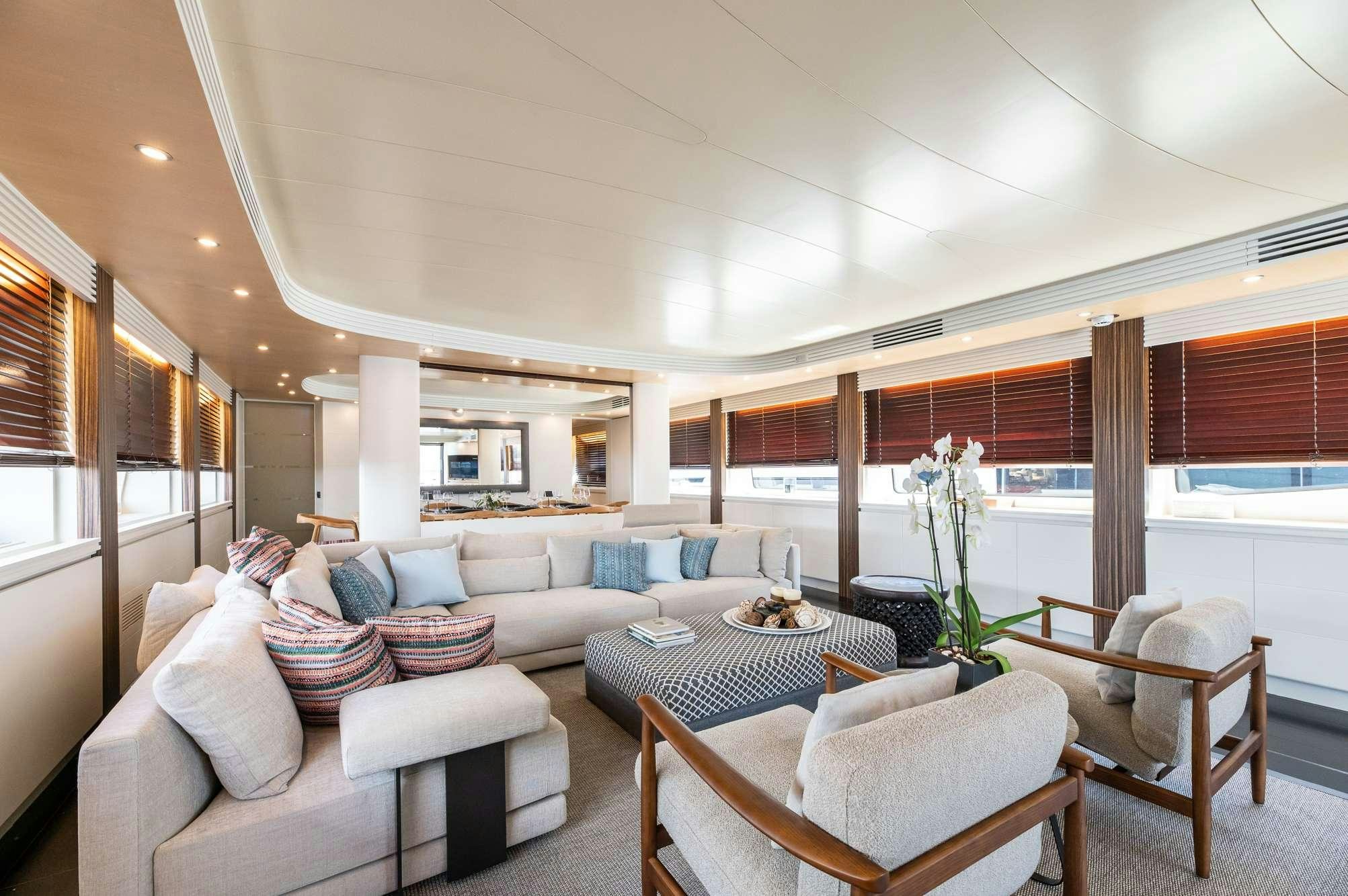 a living room with a large window aboard PEREAKI II Yacht for Charter