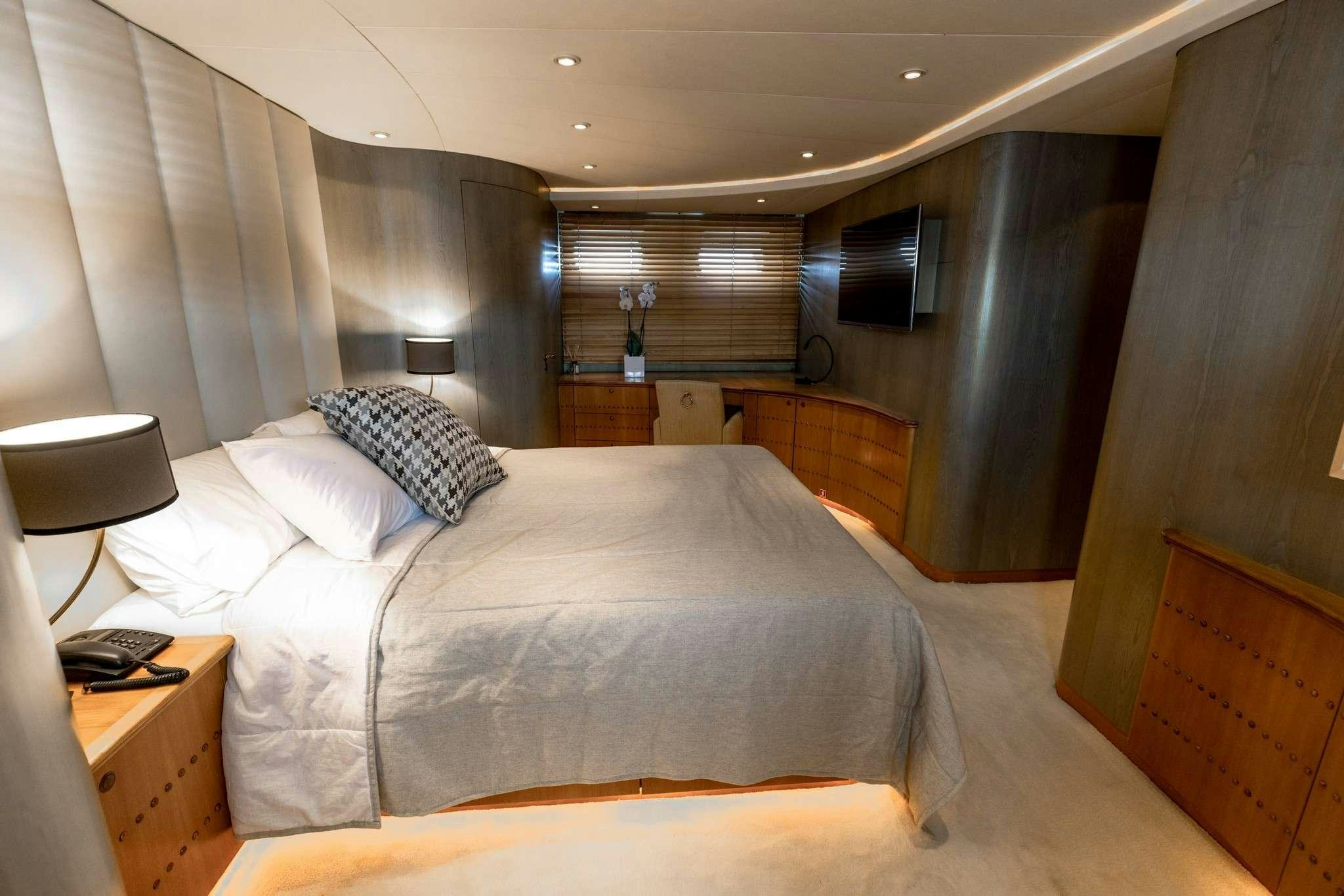 a bed in a room aboard MOBIUS Yacht for Charter