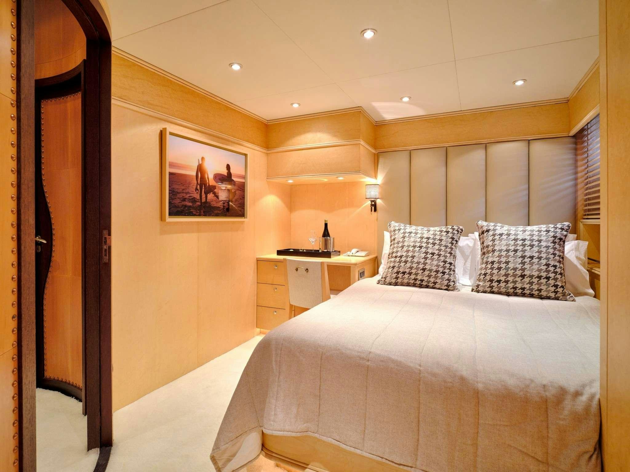 a bedroom with two beds aboard MOBIUS Yacht for Charter