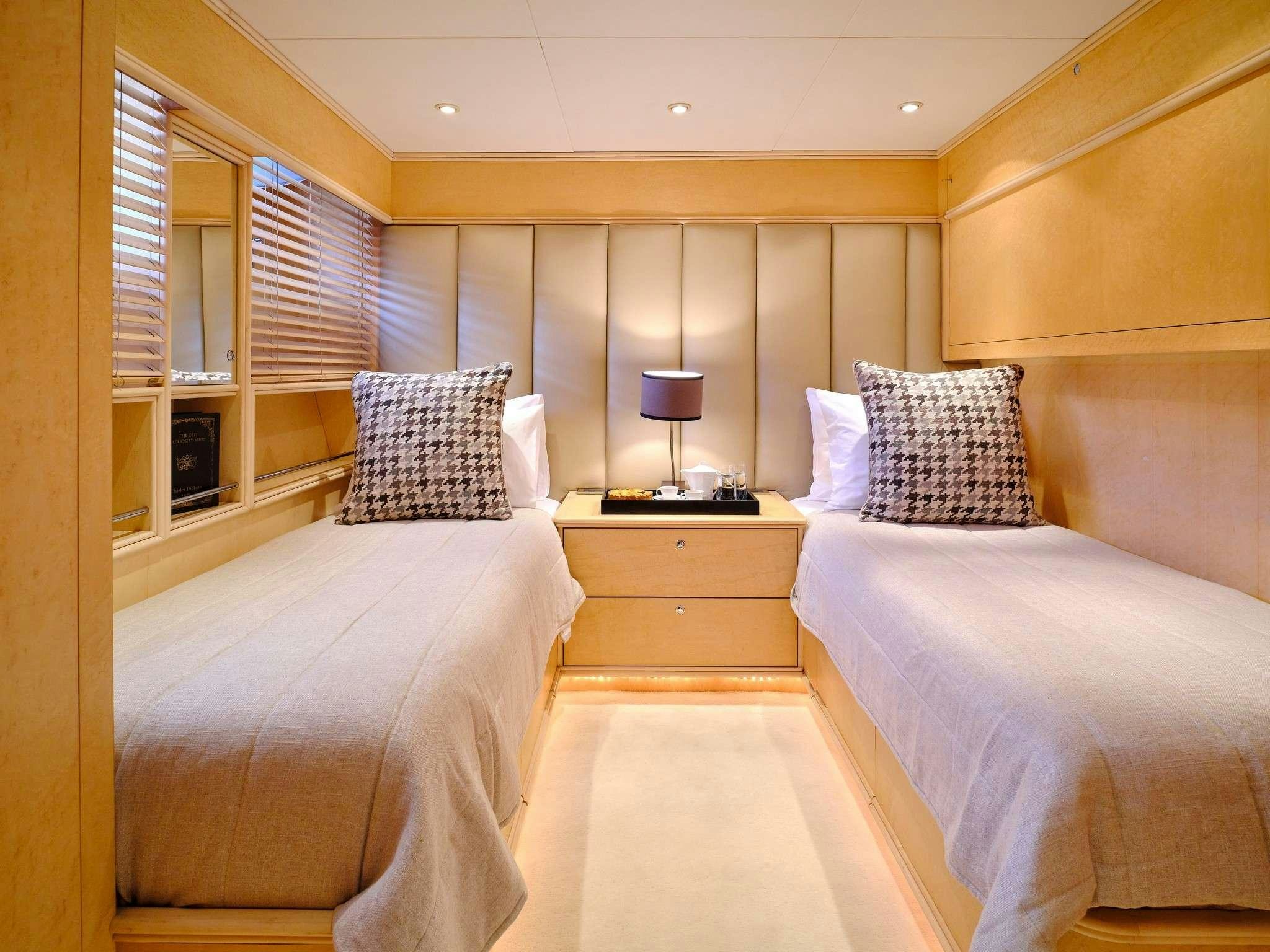 a room with two beds aboard MOBIUS Yacht for Charter