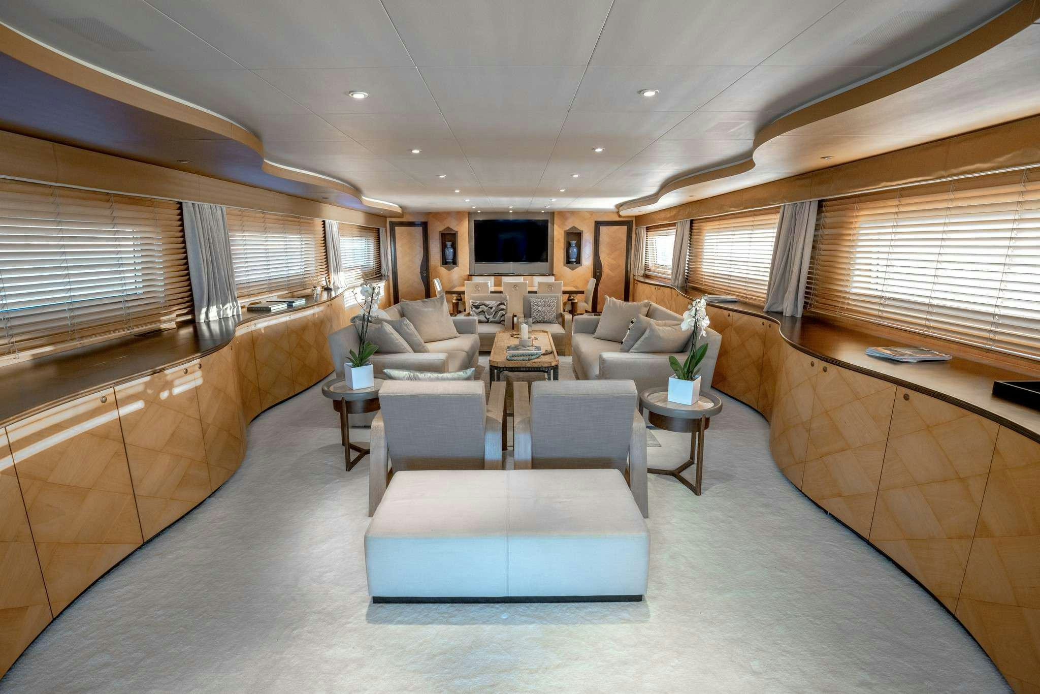 a living room with a large window aboard MOBIUS Yacht for Charter