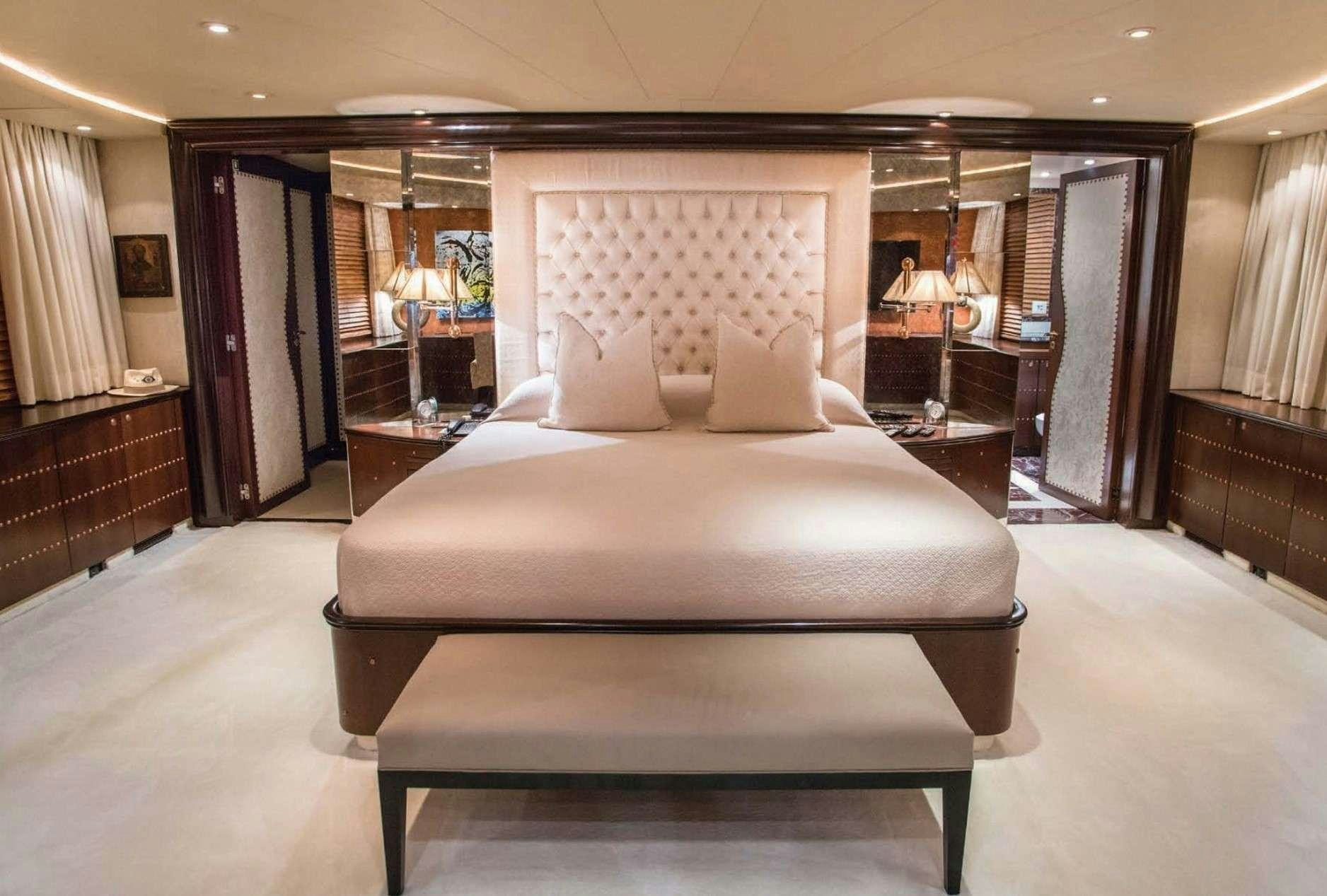 a large bed in a hotel room aboard MOBIUS Yacht for Charter