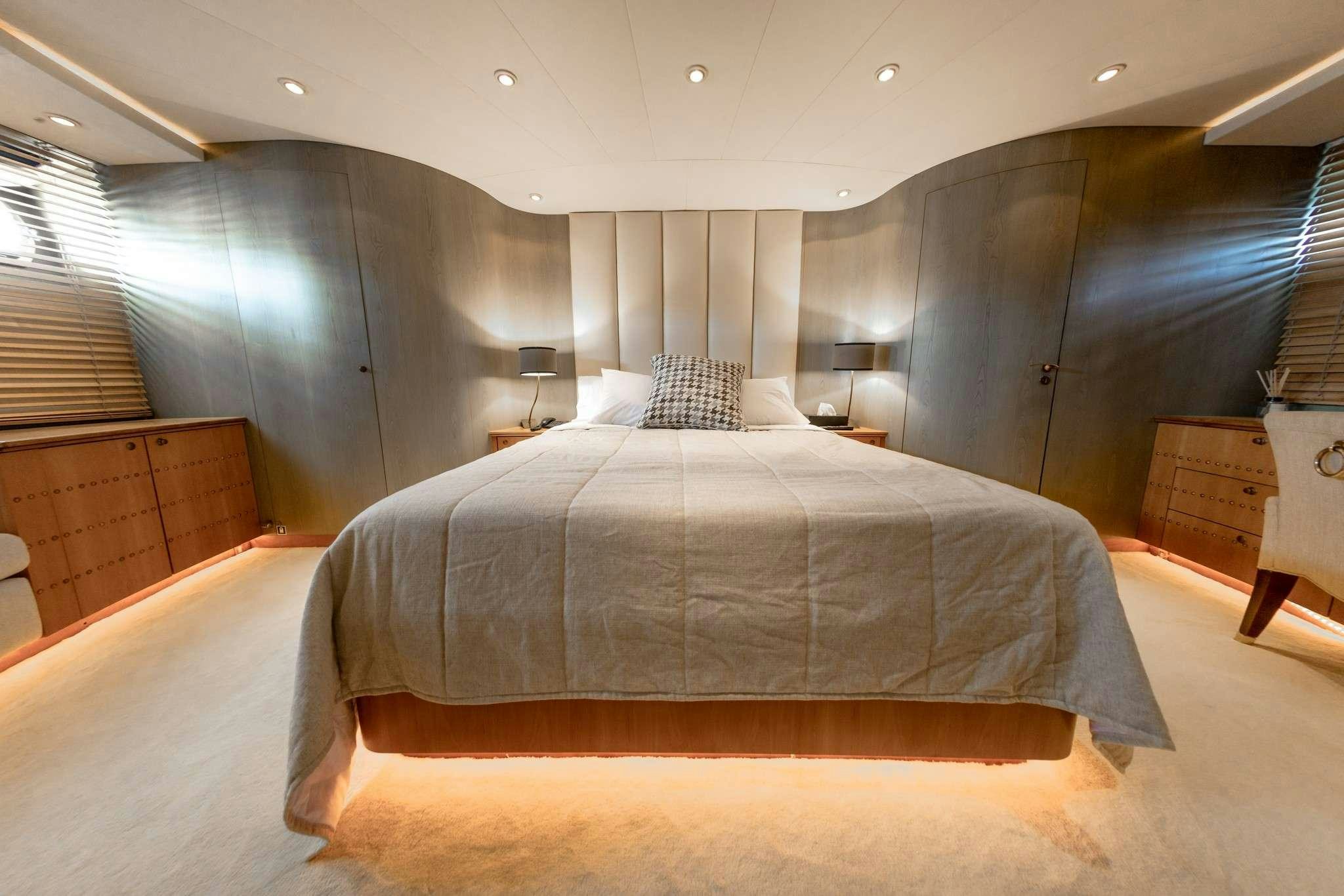 a large bed in a room aboard MOBIUS Yacht for Charter