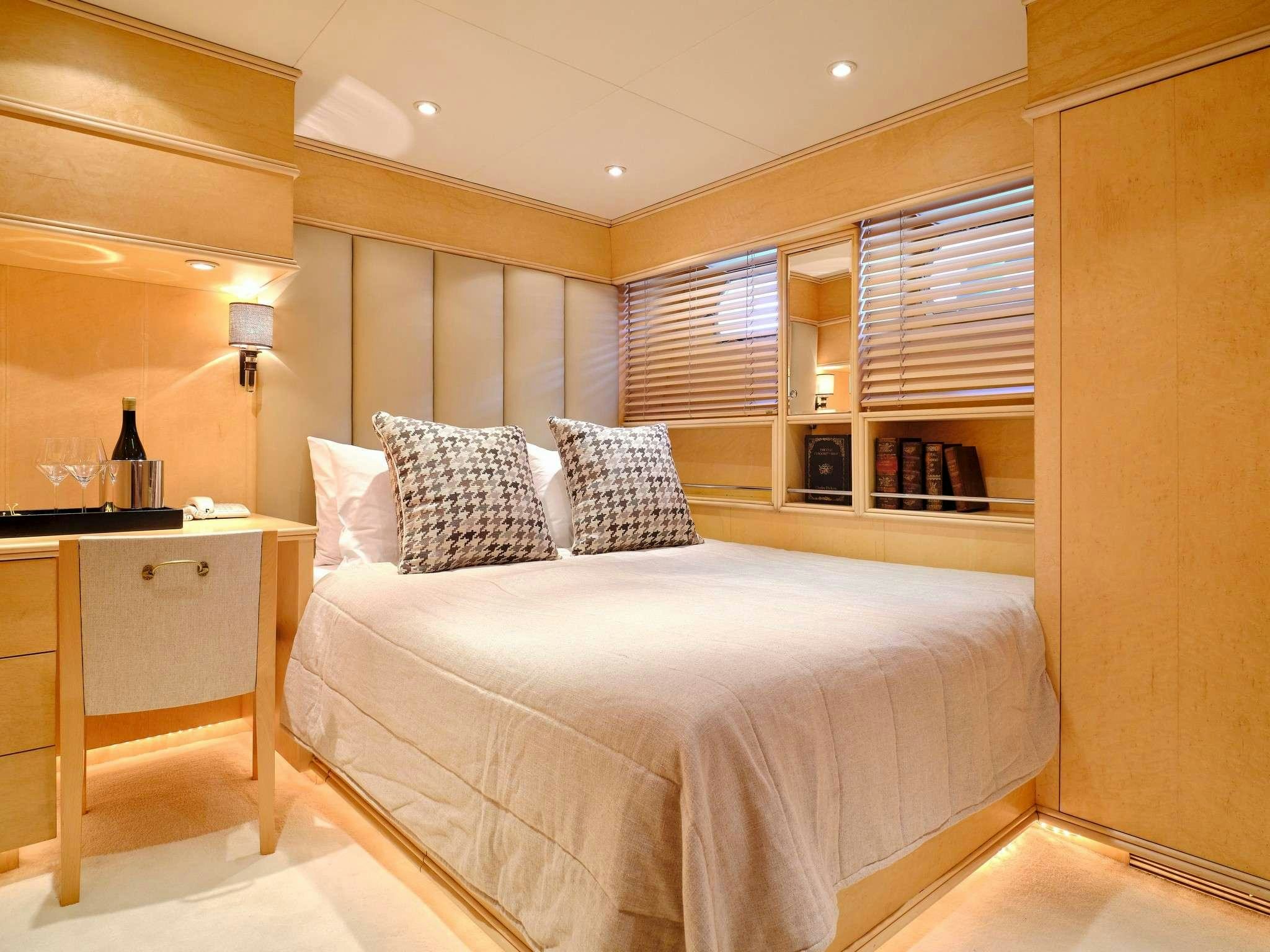 a bed in a room aboard MOBIUS Yacht for Charter