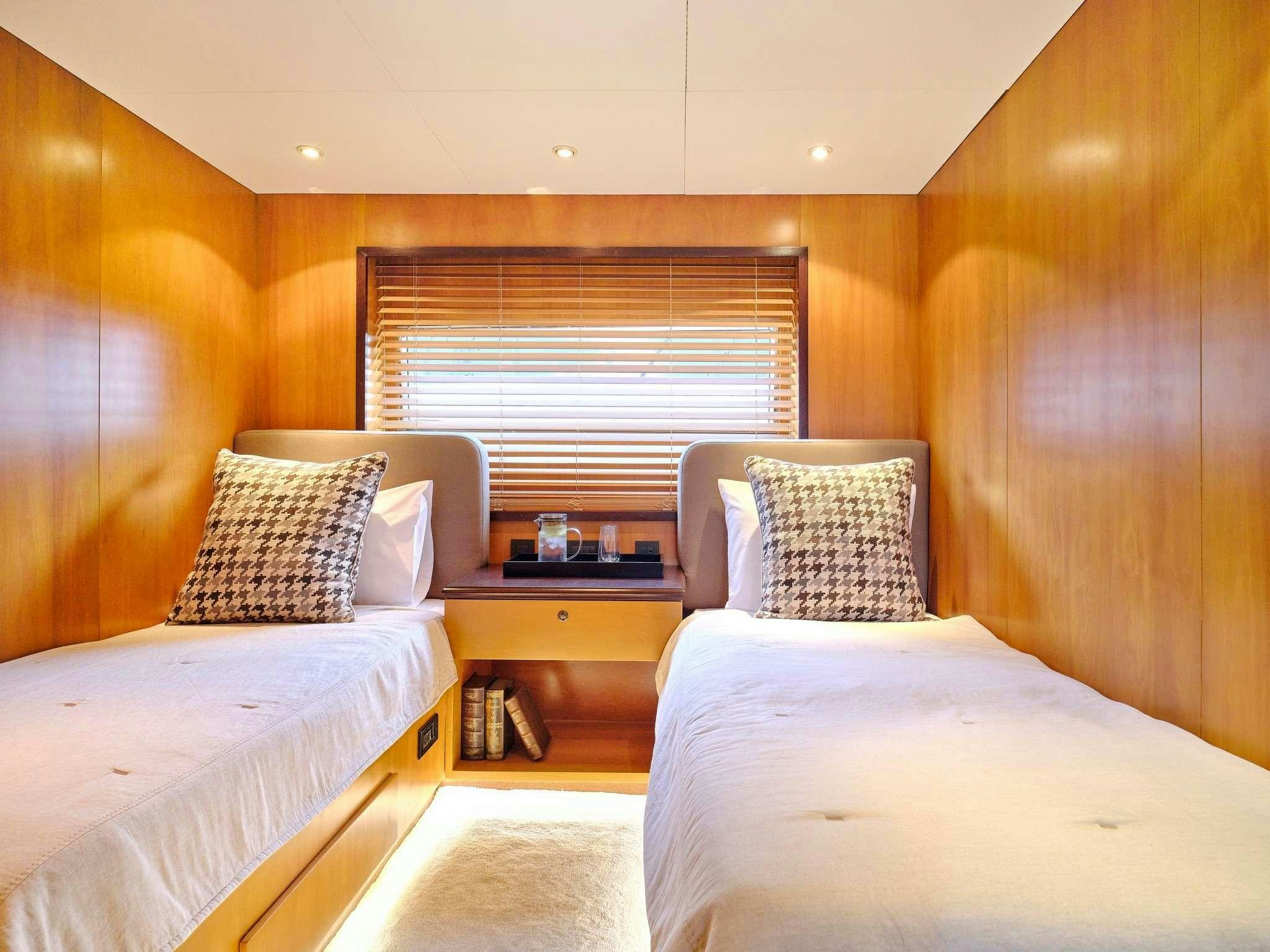 a couple of beds in a room aboard MOBIUS Yacht for Charter