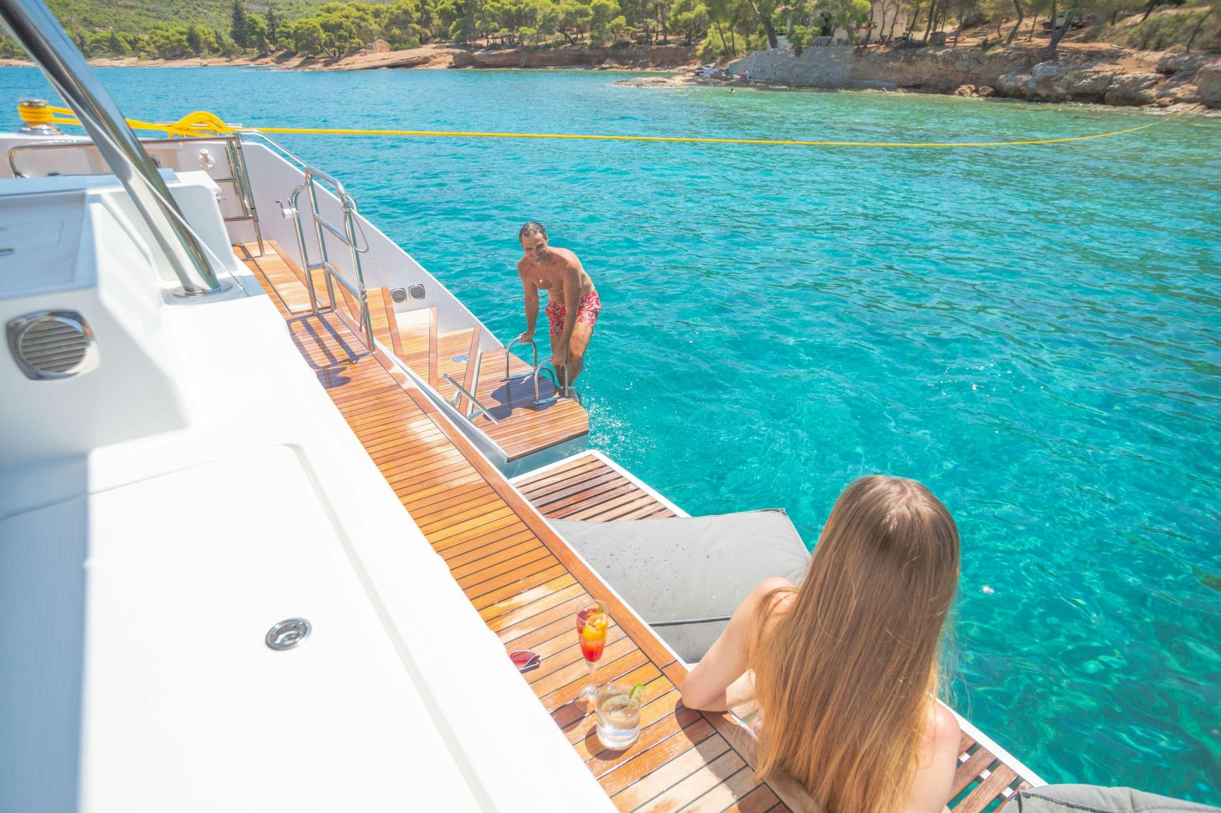 a person standing on a boat aboard ELLY Yacht for Charter