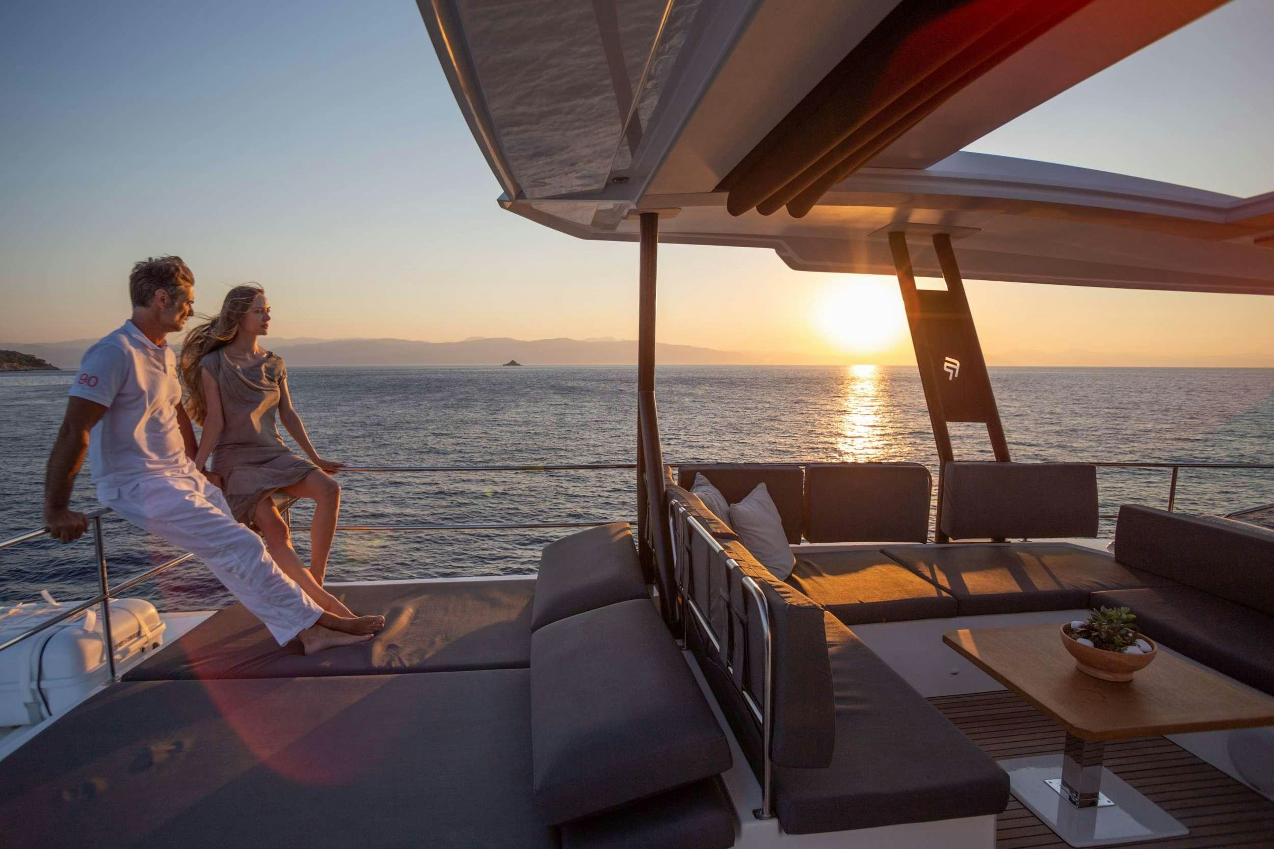 a couple sitting on a boat aboard ELLY Yacht for Charter