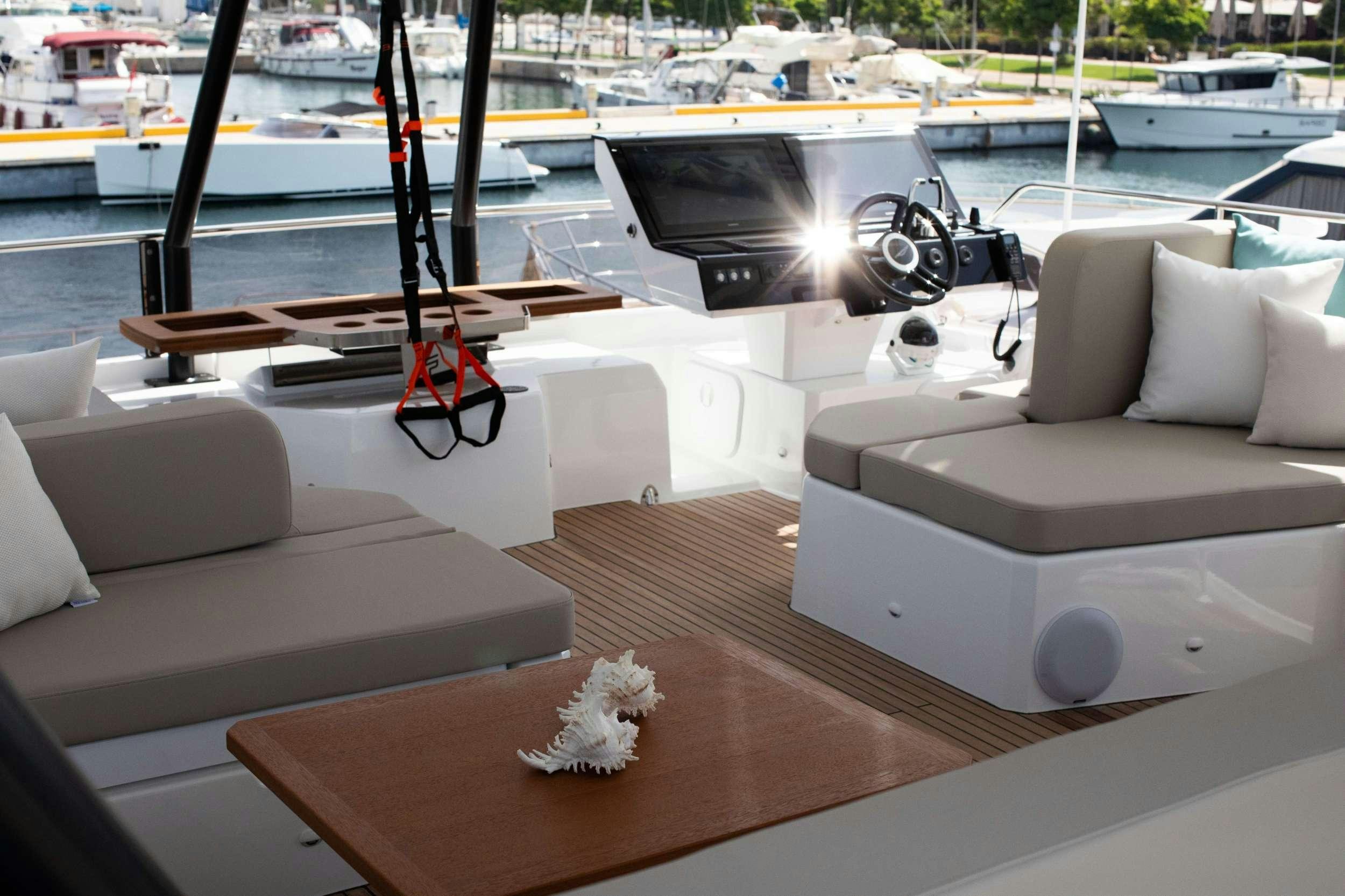 a room with a table and couches aboard ELLY Yacht for Charter