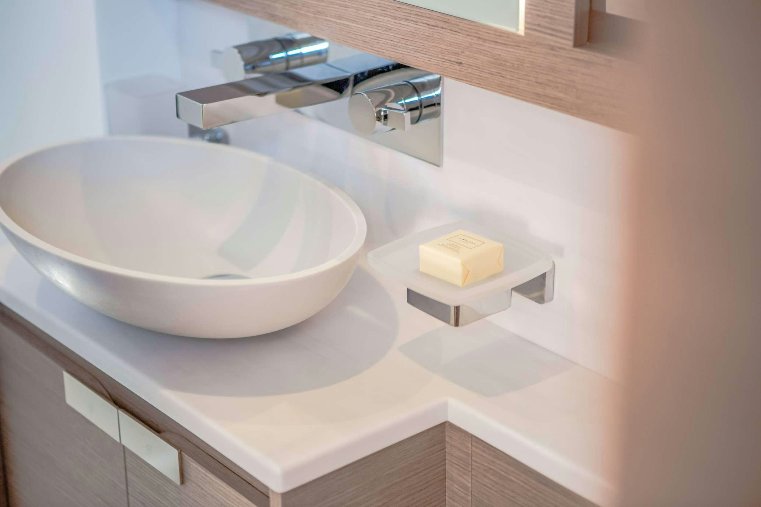 a white bathtub with a square sink aboard ELLY Yacht for Charter