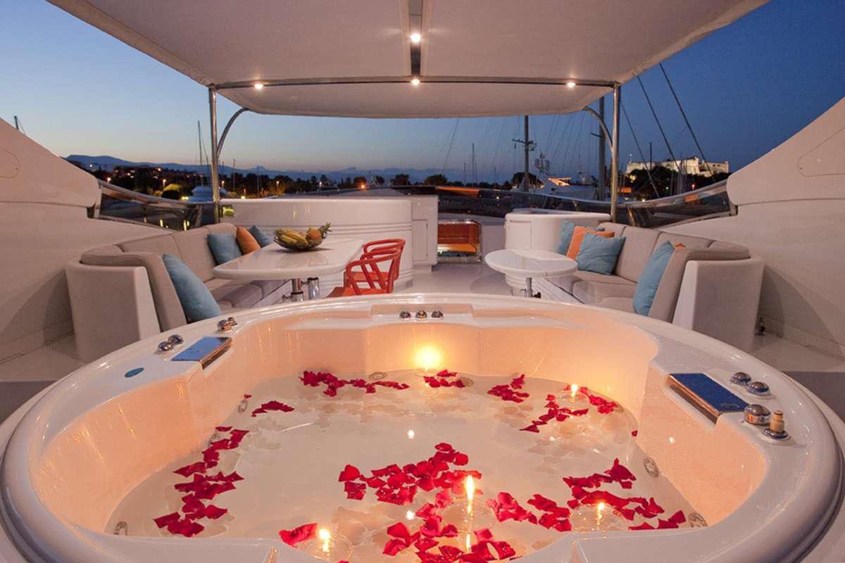 a large cake sits on a table aboard COCA VI Yacht for Charter
