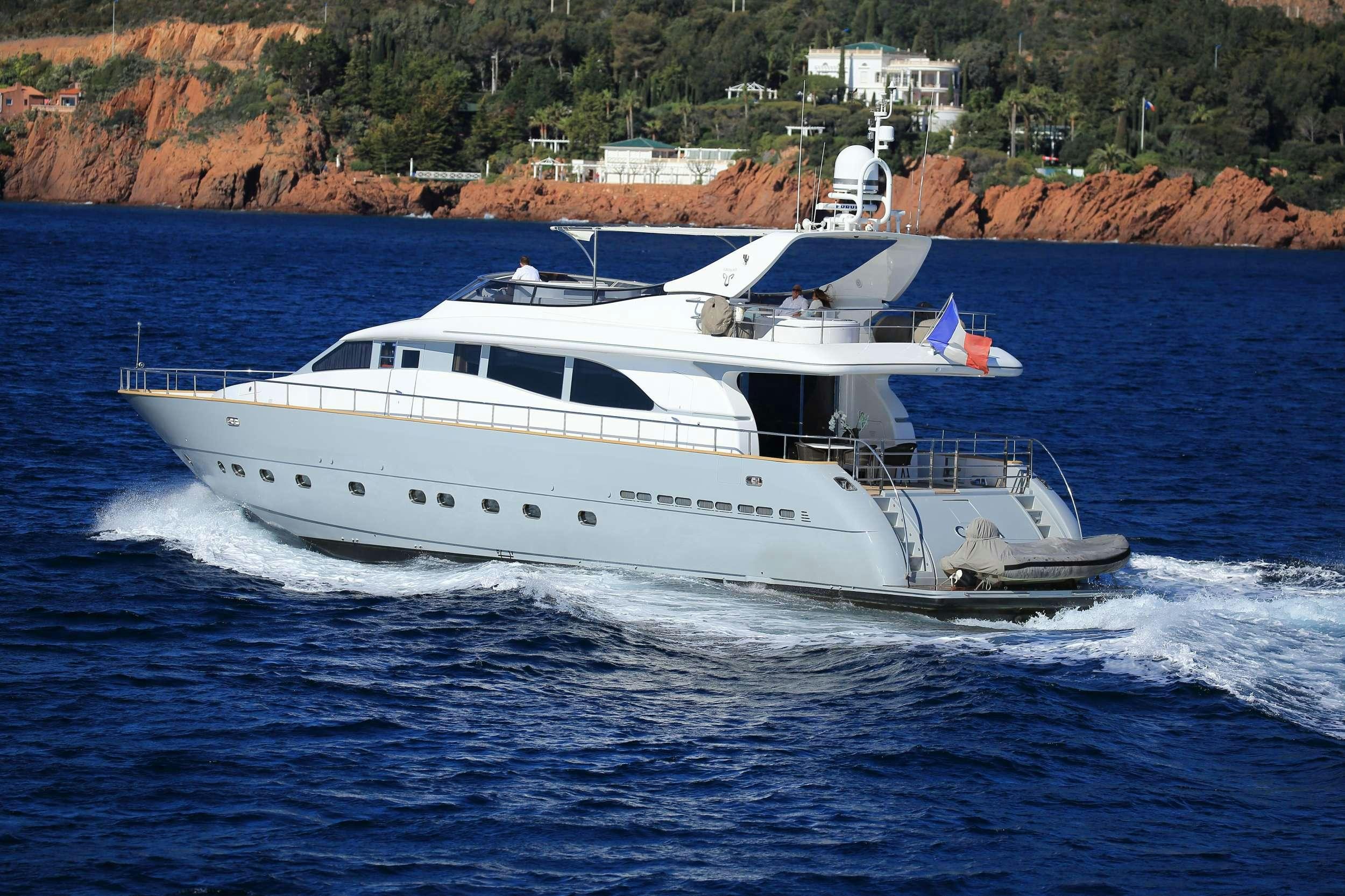a white yacht on the water aboard COCA VI Yacht for Charter