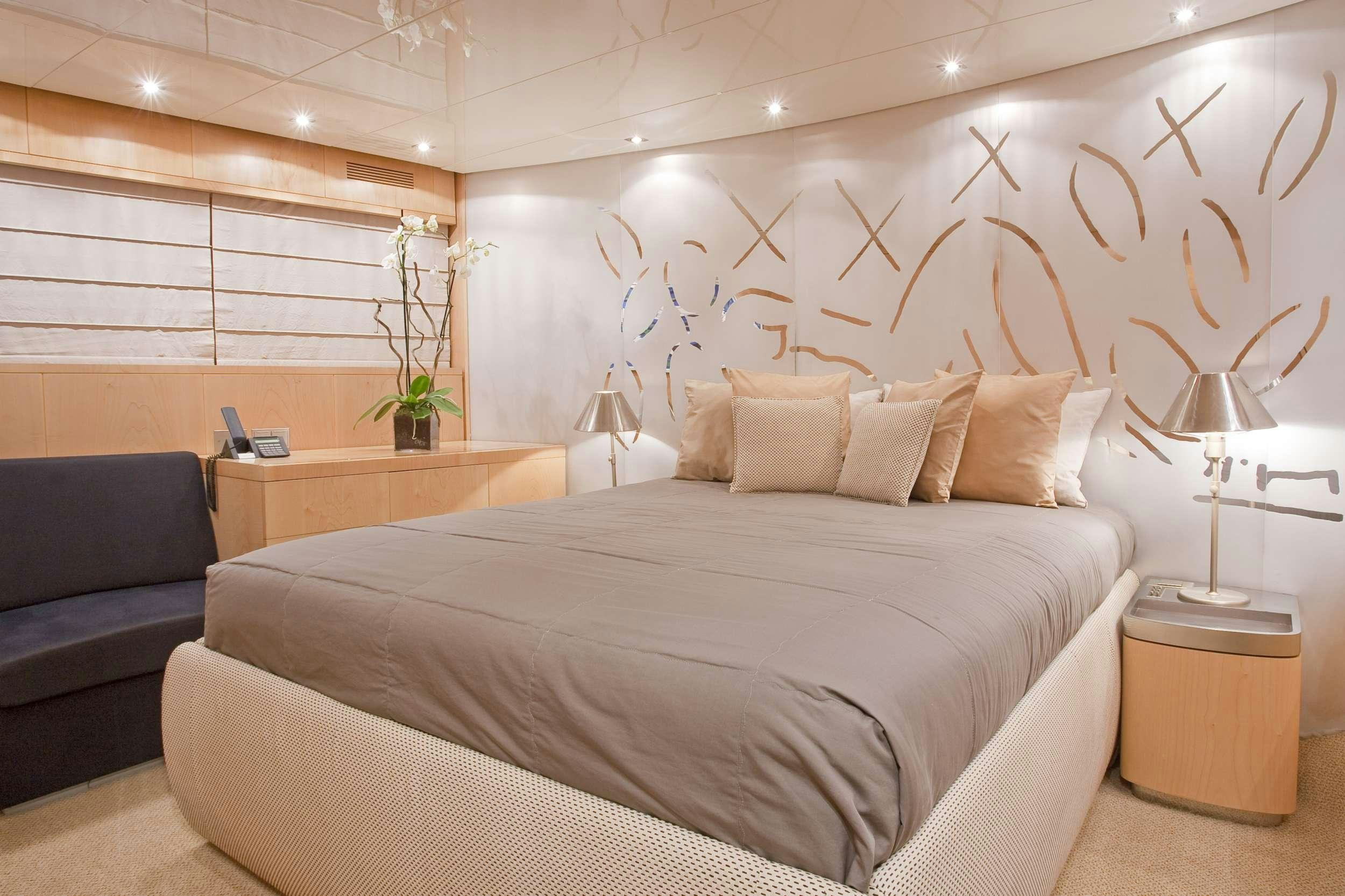 a bed in a room aboard COCA VI Yacht for Charter