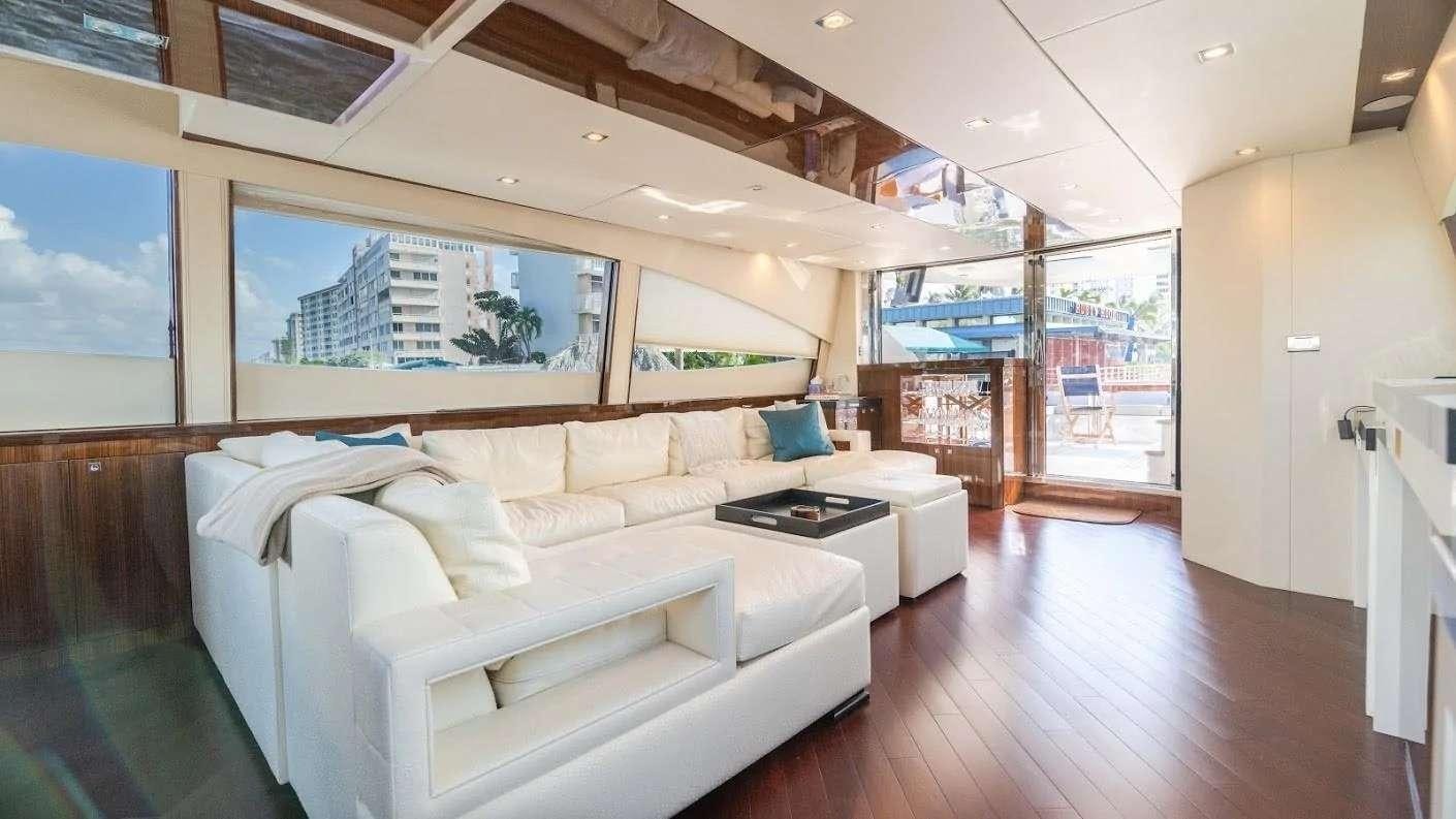 a room with a bed and a couch aboard NEW LIFE Yacht for Charter