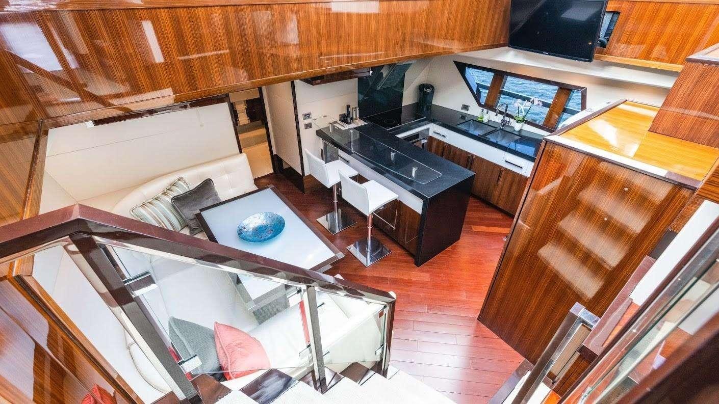 a kitchen with a sink and a microwave aboard NEW LIFE Yacht for Charter