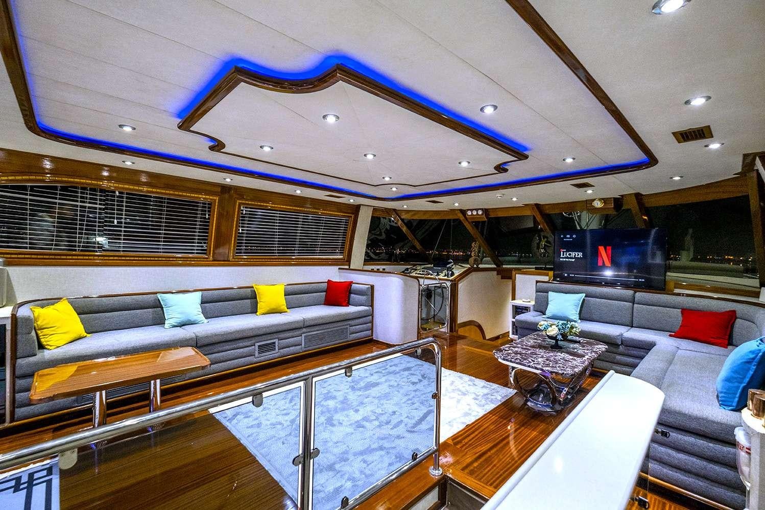 a large room with a pool table and couches aboard DESTINY Yacht for Charter