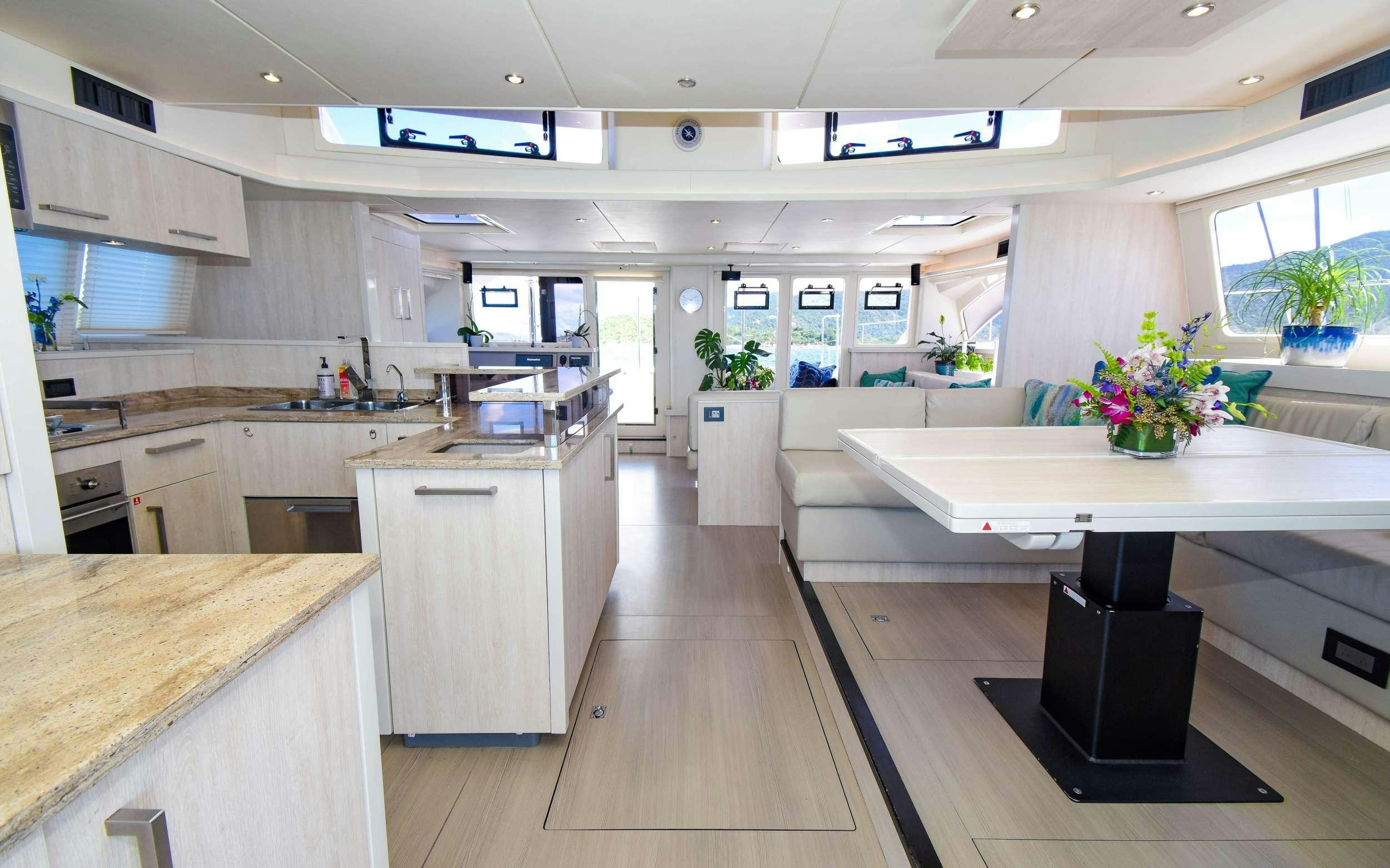 a kitchen with a large island aboard LEEWAY Yacht for Charter