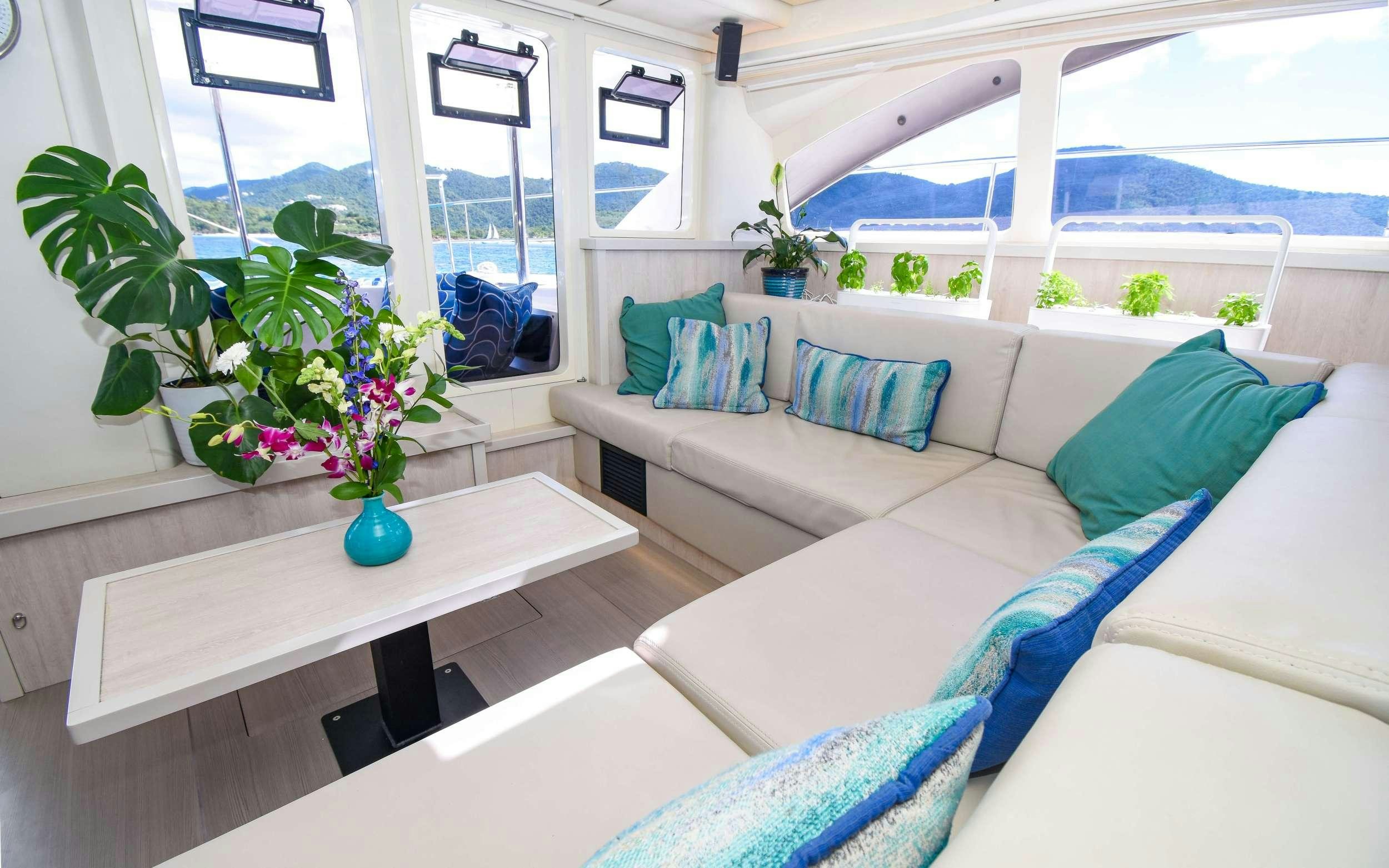 a living room with a couch and a table aboard LEEWAY Yacht for Charter