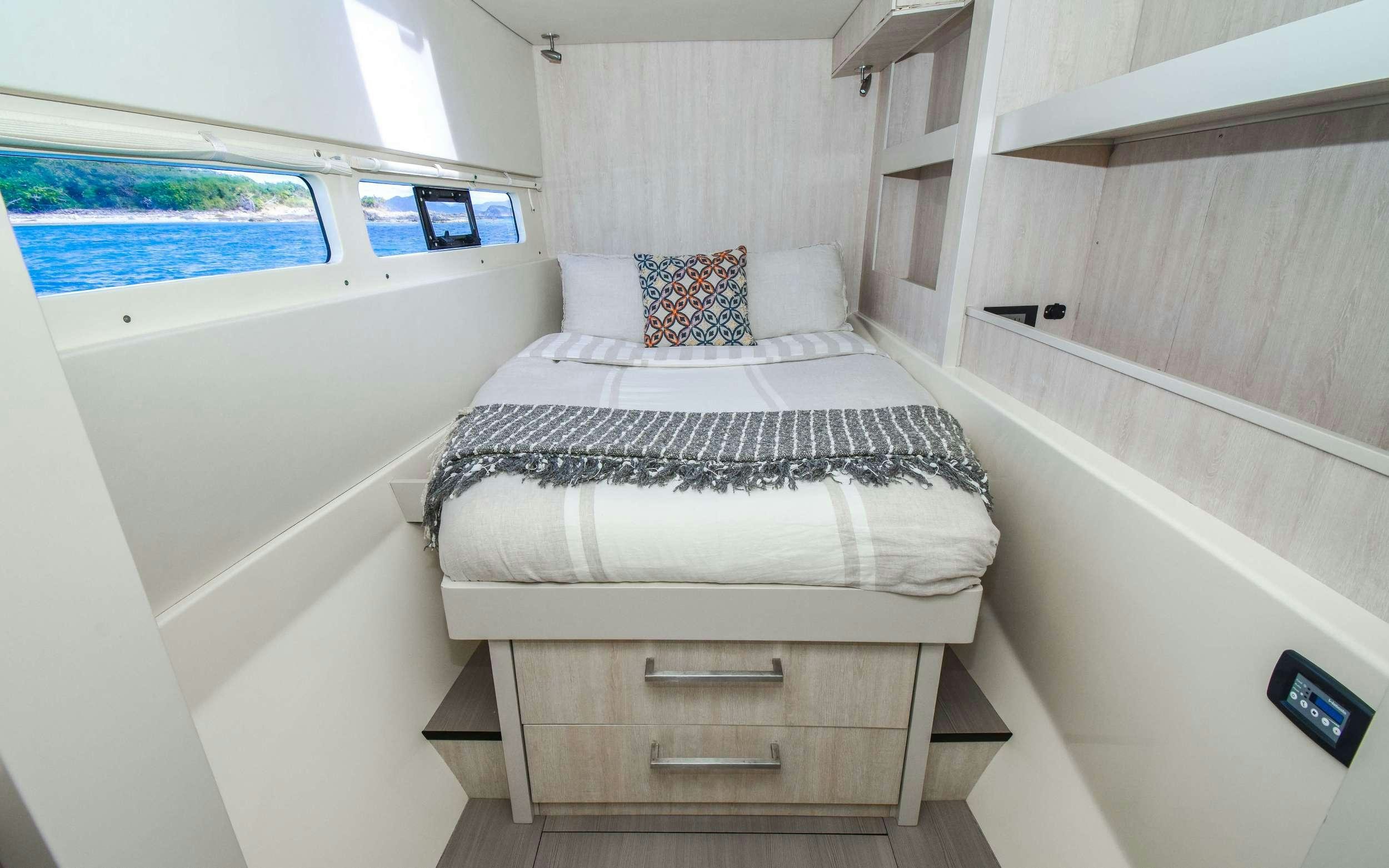 a bed in a room aboard LEEWAY Yacht for Charter