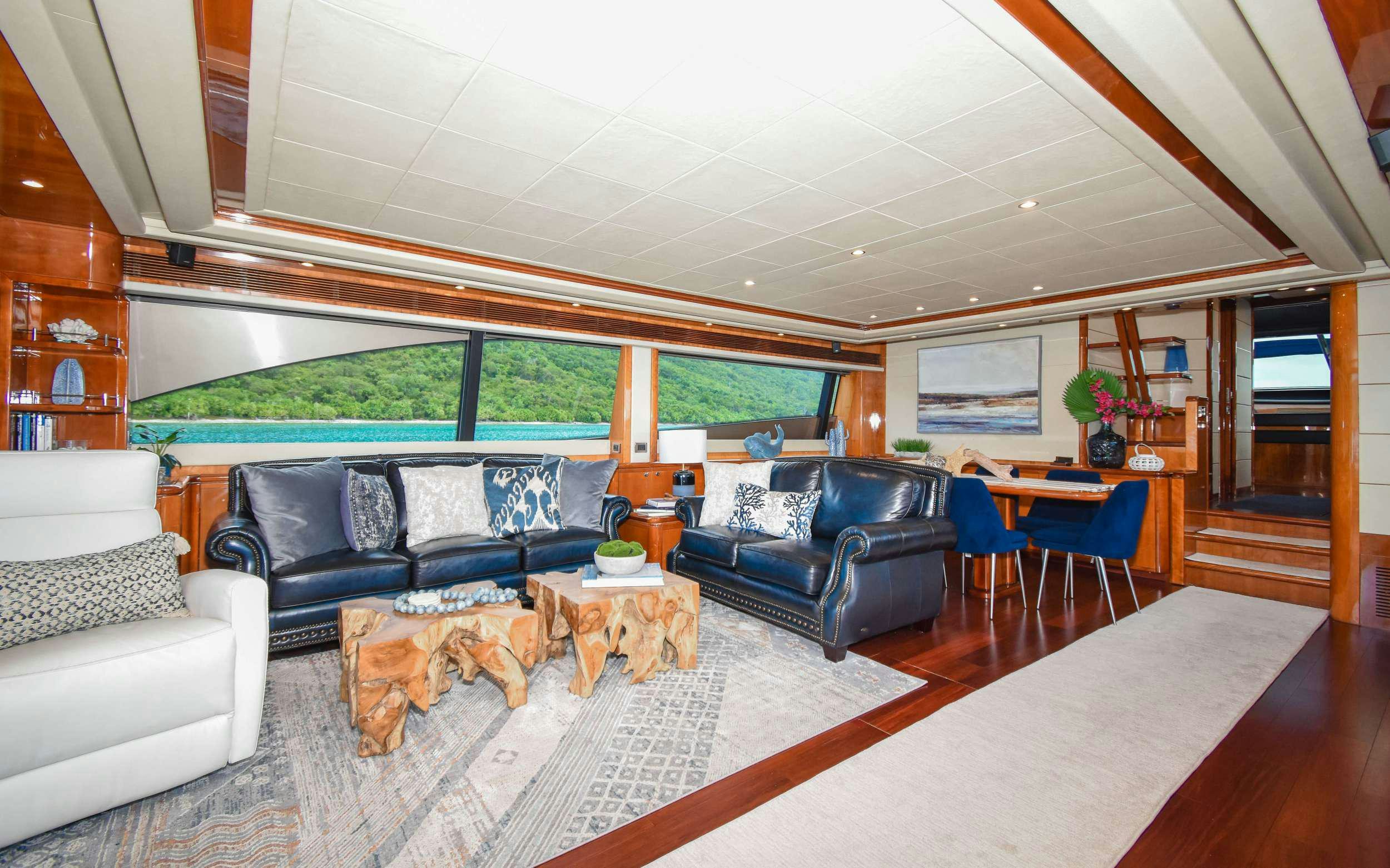 a living room with a large open floor plan aboard INDULGE II Yacht for Charter