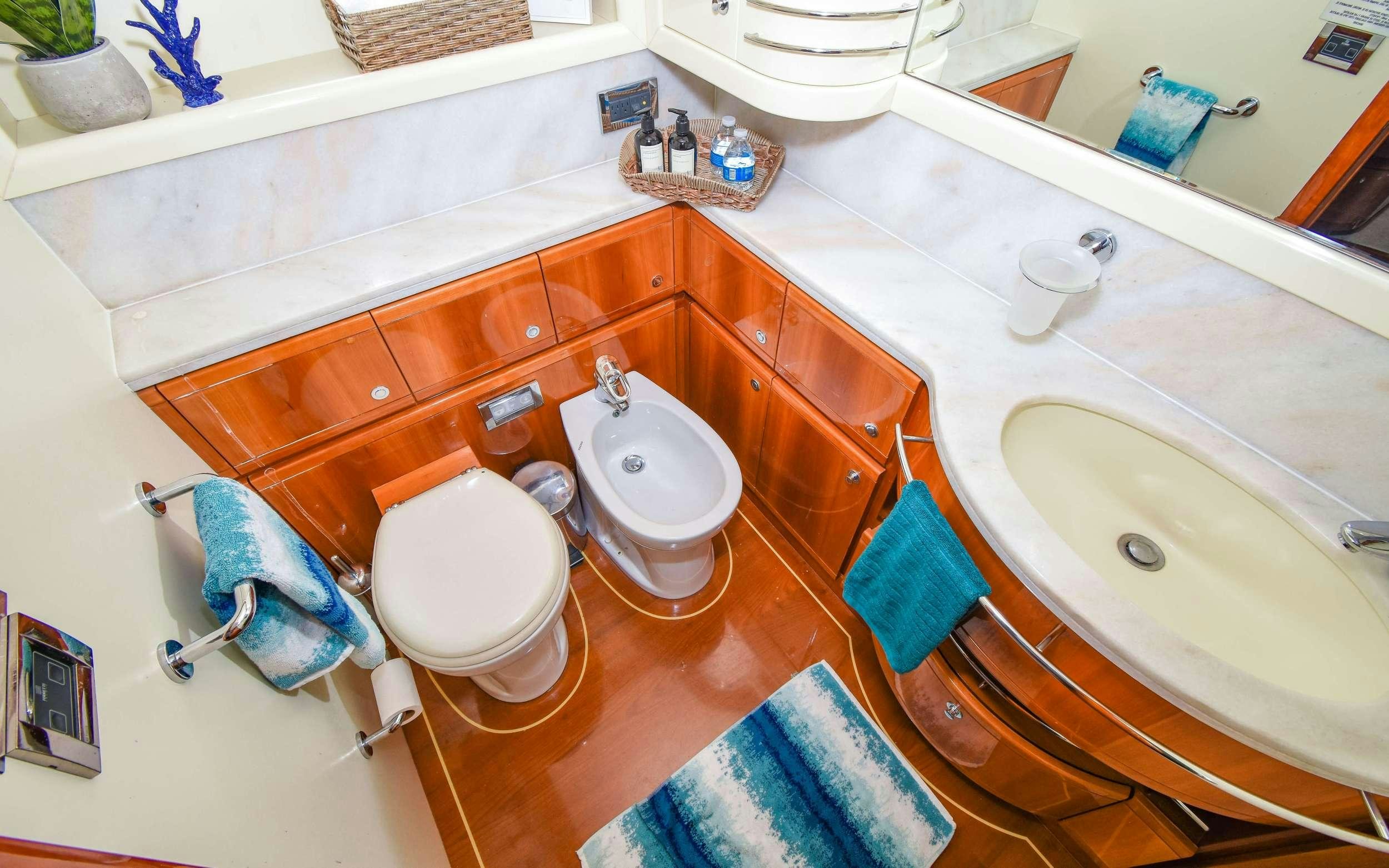 a bathroom with a couple of sinks aboard INDULGE II Yacht for Charter