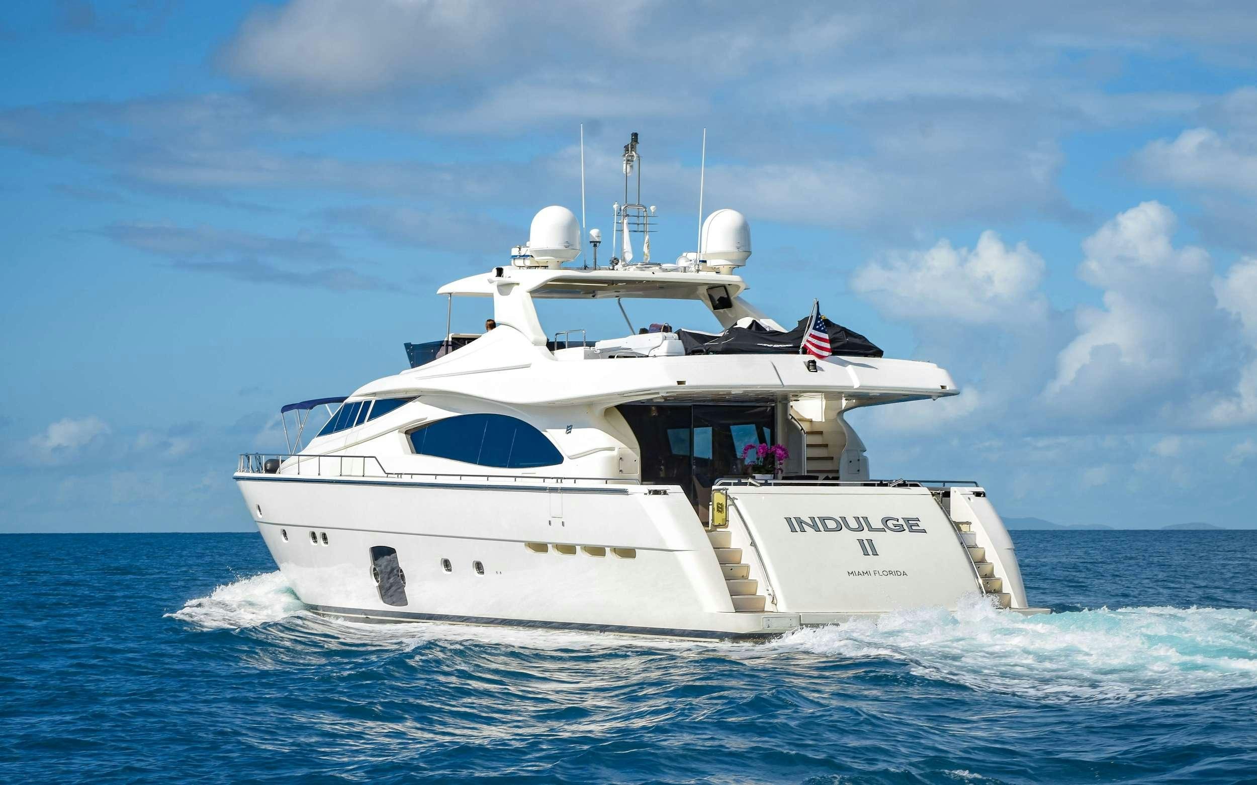 a white boat in the water aboard INDULGE II Yacht for Charter