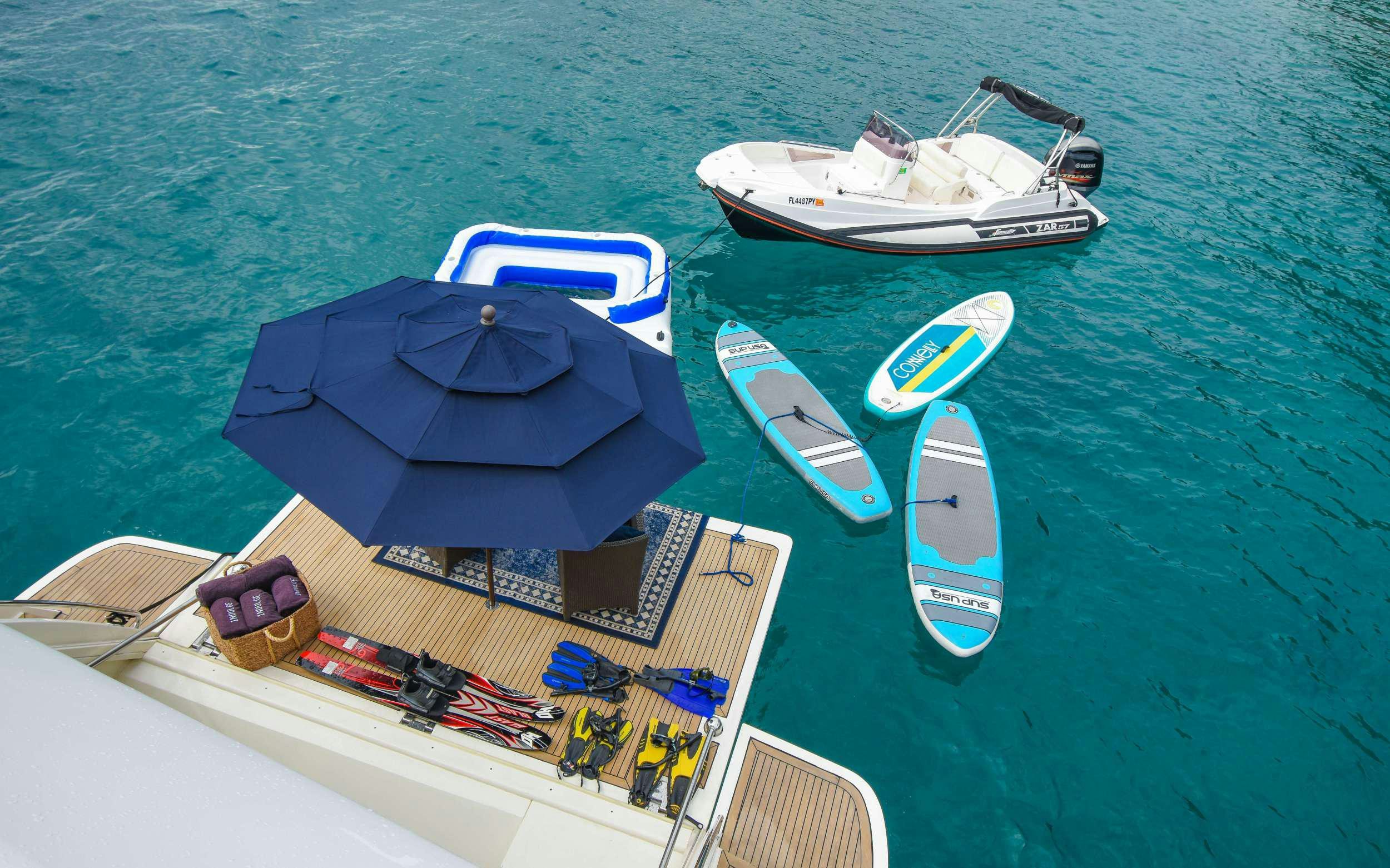 a group of boats on the water aboard INDULGE II Yacht for Charter